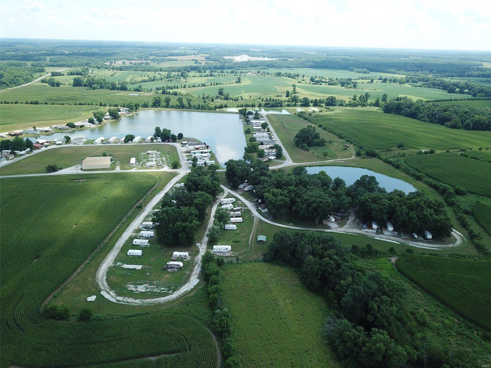 93 acres Monroe County, MO. 30 acres tillable paying $160/acre cash rent 4 year lease. Lake Village Hotel and campground on site including 70 camper pads (50 rented at $1400/yr), 65 mobile home pads ($175/month), 23 room hotel and restaurant available. Hotel is approx. 10,350 sq ft and the restaurant is 6,532 sq ft. Banquet center was turned into an apartment and rents for $700/month. 14 acre private stocked lake. Only 10 min. from Mark Twain Lake. Expenses will be updated next week. Location: Rural