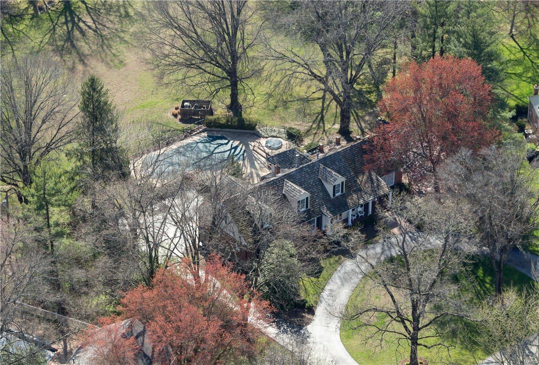 New Price on this 1.5 story traditional home, makes home ownership on one of Frontenac's most powerful addresses, Countryside Lane, a closer reality and now within reach. Situated at the furthest and most private end of the cul-de-sac. Resting on just under 2.0 level and flat acres, this 5 Bedroom /6Bath home can be one of the finest entry-level opportunities to experience this prestigious lane, or may be one of the very best and most distinguished lots in a picturesque, bucolic setting; one that is completely private with unobstructed views. In close proximity to some of St Louis' highest status new construction properties, this  5,000SF+ total living area property also enjoys a private pool and deck, secluded from all neighbors. 3 bedrooms on main + 2 bedrooms and living area, om 2nd. Master Suite features organized walk-in closet and heated floors in Master bath.  Eat-in kitchen and breakfast room. Above grade, finished walkout lower level is equipped with bar and fireplace.