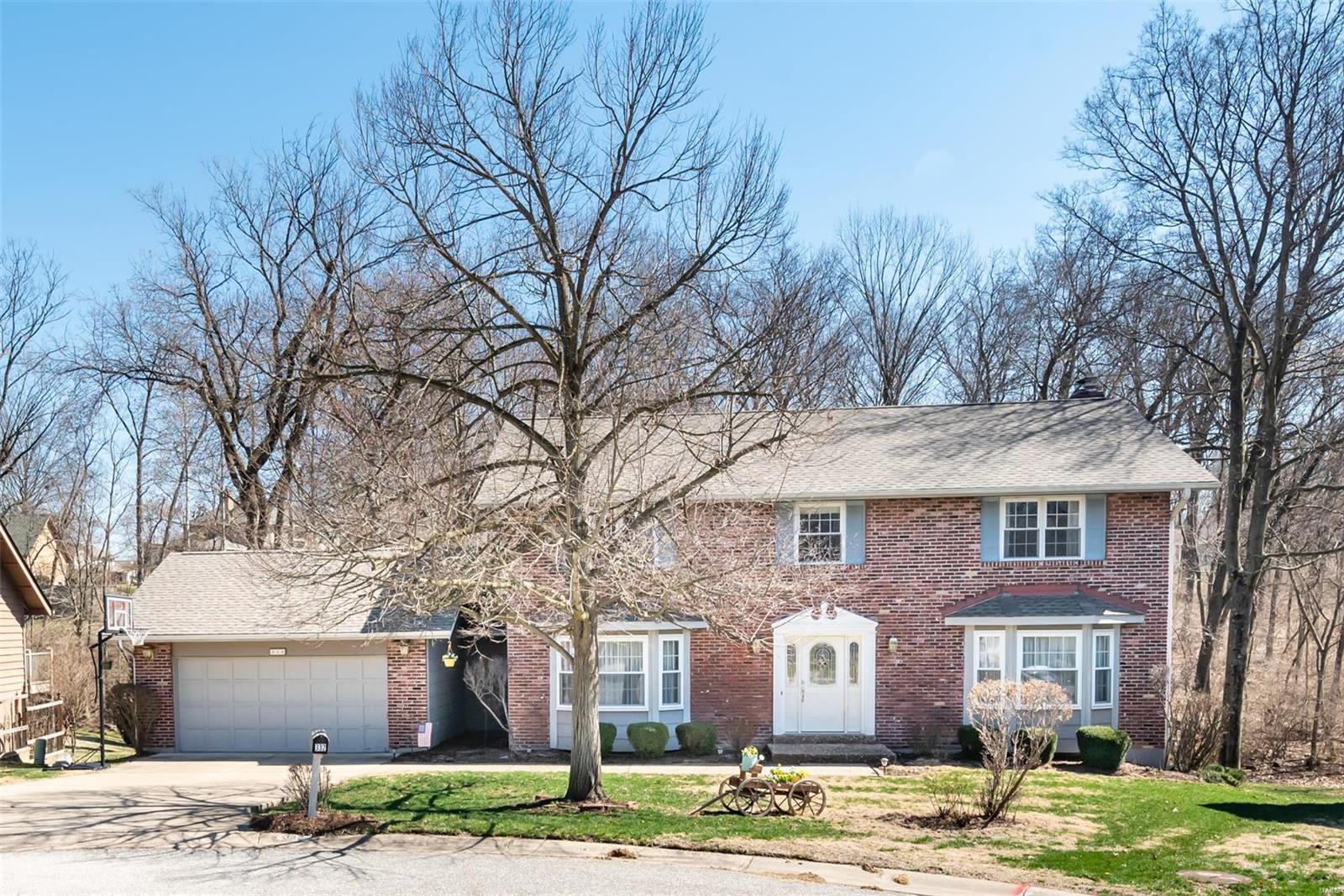 Located on nearly a 1/2 acre cul-de-sac lot, this two story in Heritage subdivision truly has it all! This home features an entry foyer with hardwood floors and a separate dining room and living area with bay windows. Family room offers hardwood floors, wood burning fireplace and wet bar.  Kitchen with granite countertops, stainless steel appliances, built in shelving and a bay window. Upstairs you'll find a huge master suite to retreat to with luxury bath with soaking tub and shower as well as three other spacious bedrooms and a full hall bath. Finished lower level with new carpet (2018) to accommodate all your entertaining needs and walks out to your gorgeous level lot backing to a creek and woods.  New A/C and water heater. New roof (2017). See supplements for list of all recent improvements.