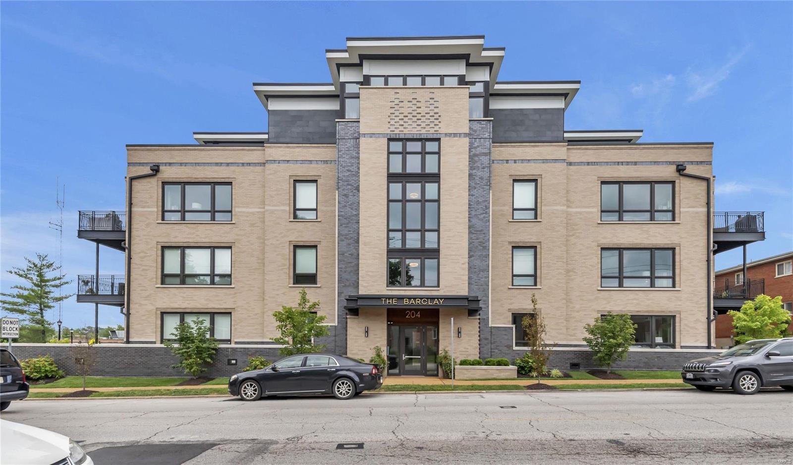 Luxury awaits in this like new 2 bed + den condo w/ over 1800 sf in the heart of Kirkwood! The beautiful building entry leads to the elevator taking you to the 1st floor entrance. A stunning foyer w/ rounded wall opens to large open floor plan. The kitchen features custom cabinetry w/ center island, tile backsplash, gas cooktop, double ovens, built in microwave & SS fridge. The dining area is open to the kitchen w/ custom chandelier. The expansive LR features floor to ceiling windows & fireplace w/ built in shelving & wood mantle. Off the LR is a den, perfect for an office/library. The sunlit master suite features floor to ceiling windows w/ a view of the balcony, large bathroom w/ double sinks, walk in glass shower & customized closet. A second bedroom w/ double closets & full bath w/ tub/shower combo complete the unit. Relax on your large balcony, in view from main living areas & master suite. Hardwood flooring throughout, recessed lighting, 2 assigned parking spaces & storage unit. Location: Corner Location