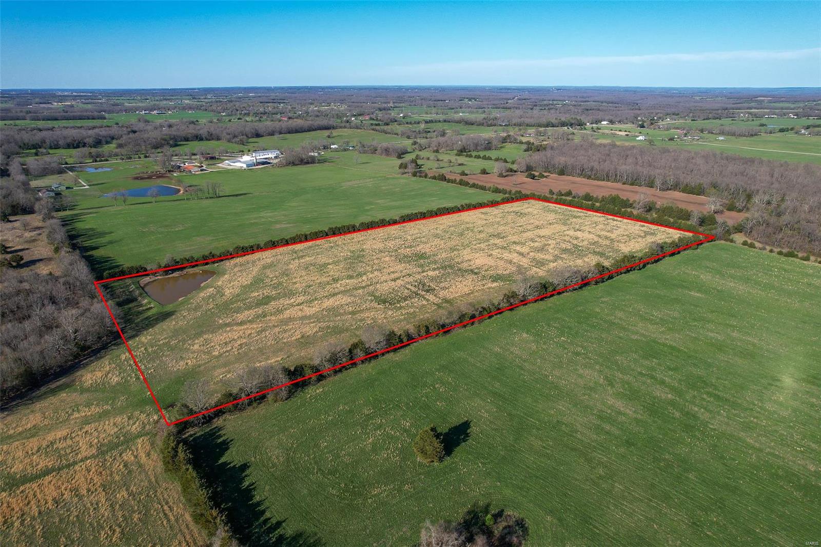 Discover the perfect 18.7-acre property that you've been searching for, situated only 6 minutes from city limits. Currently functioning as a hayfield, this expansive lot offers limitless potential. Whether you decide to continue using it for hay production, raise livestock and horses, or build your dream home, the possibilities are endless. The property features a charming pond nestled in one corner, which can be utilized for animal use or if you choose to stock with fish, recreational fishing. Access to the property is made easy via a recorded easement and driveway. Make the most of this incredible chance by scheduling your viewing today!