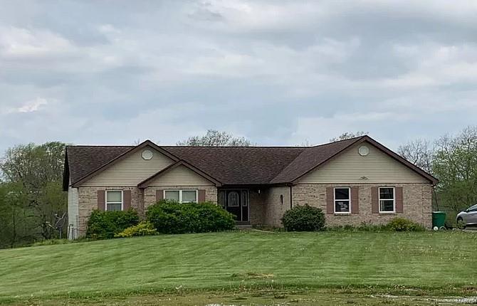 This beautiful custom built home situated on 3 parklike acres was built to perfection.  The sunset view from the deck is amazing.   With 2 x 6 construction,  Hurricane Strapped, 9' walkout basement with safe room and everything needed for full bath except the toilet (drywall, tub/shower, sink),  fully insulated garage with heating and cooling, HVAC replaced 05/12/2021, 16' x 16' covered deck overlooking the large back yard, wet weather creek, and large farm.   This one won't disappoint.  A little flooring and paint and you will be ready to move in.  Home is being sold AS IS.   Inspections for buyers informational purposes only.