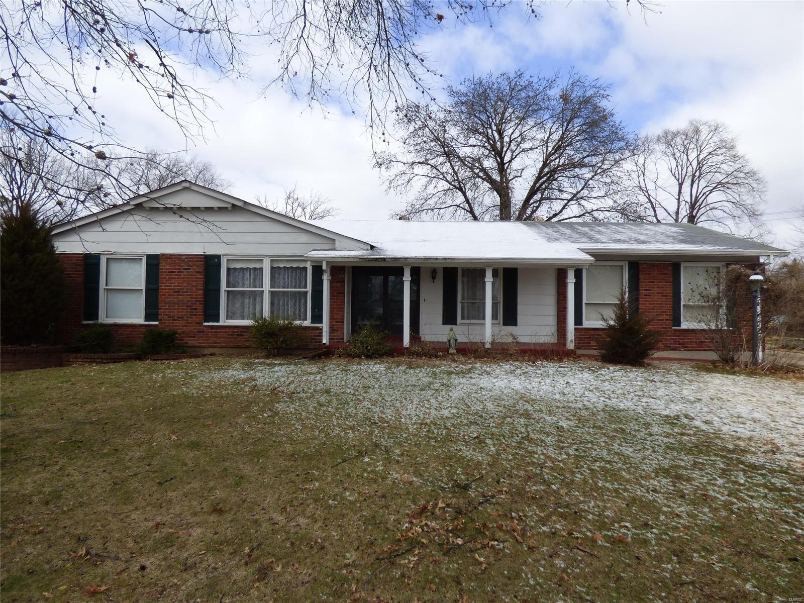 This  1614 sq ft, ranch style, all brick home features three bedrooms and two full bathrooms. Like most of the home, the spacious family room has hard-wood floors and offers a wood burning fireplace. The generously sized master bedroom includes a full bathroom and a sliding glass door leading to a charming brick patio in the backyard. The finished basement brings another sizable living space. Plus it has a closed in storage area with built in wood shelving and a work bench. At just over a third of an acre, the property offers an over sized, two car, rear entry garage and a 30'x30' concrete pad that is perfect for extra parking. In the summertime, the semi-private backyard is perfect for backyard BBQs or other  summertime activities. Close to schools , shopping and restaurants.