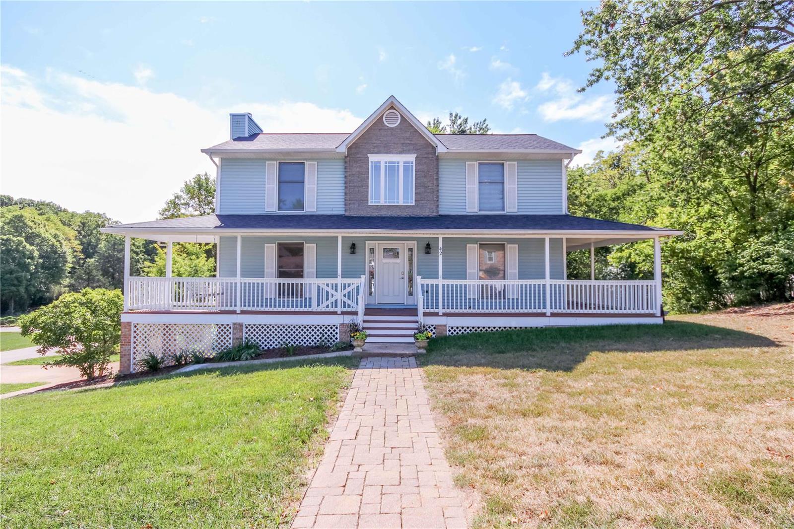 Location, Location, Move right in to this lovely 2 story with huge wrap-around porch, mature trees, all sitting on a large private corner lot with 2 car side entry garage. 3 Bdr. 2 1/2 baths, Interior completely painted, so many updates, Kitchen Cabinets, pull out drawers, Riverstone Quartz countertop, Farm house kitchen sink & faucet, new electric stove, Vinyl plank (wood look) flooring, Hunter ceiling fans, Attic fan, Main fl. laundry, 6 panel drs. w/new lever style brushed nickel handles & hinges. All bath rms. updated, Master Bedr & Bath Vaulted Ceiling, walk in closet, gas fireplace w/brick front, Laminate wood floors, living rm, hall & 3 bedr., new lighting, Wrap around porch , has been freshly painted, floor, ceiling & spindles. Patio, stamped flagstone look, & new composite stairs to rear patio, Classic Bldg. Amish Shed 12x10, Basement has a 21 x 11 finish rm new carpet, use as a sleeping area, play rm or office. Seller is offering American Home Shield Warranty with home.