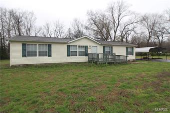 2005 Clayton Homes manufactured one story home on footing foundation with crawlspace. There are 3 bed/2 bath, separate dining room, living room, kitchen and breakfast room.  Handicap accessible master bathroom with seated shower. Detached carport and shed. Seller is offering a one-year home warranty.