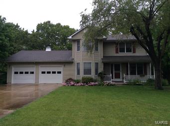 Price Reduced - Enrich your life in this 3BR/2+BA Traditional-2-story home  ideally sited on 6.60 acres that backs to woods for privacy. This engaging residence is not in a subdivision, it provides a formal dining room, kitchen remodeled in 2013 with granite counter tops, contrasting cabinet with glass doors, cozy fireplace with insert, plus walk-out basement, family room, fine master suite, main-level laundry. Dual heating and cooling, Anderson windows, 6 inch outer walls, energy efficient, ceiling fans, Hunter Douglas Blinds and attic fan. Septic system recently updated.  Two-car garage, deck with Brock flooring. Many charms to cherish!