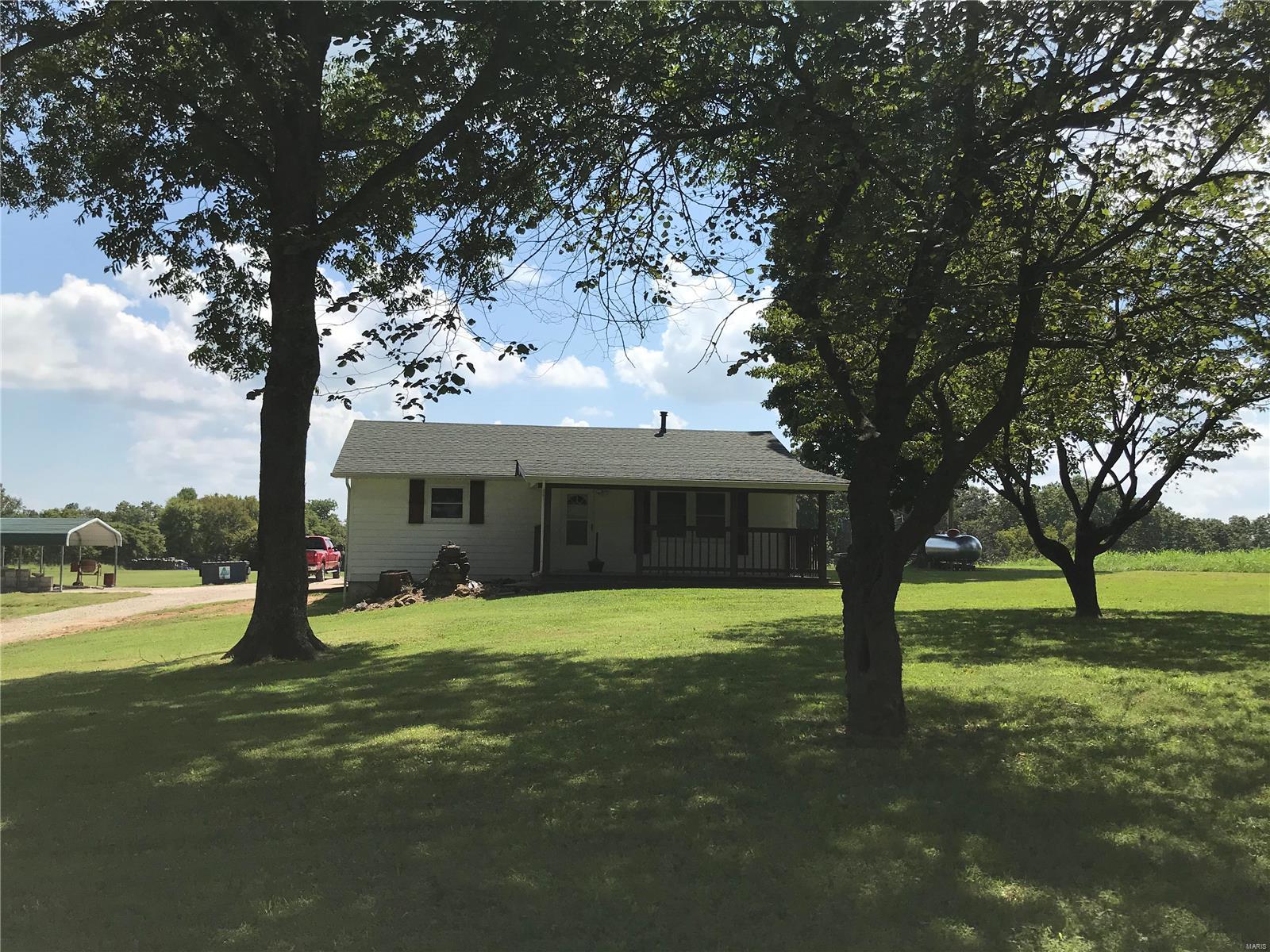 Looking for a home in the country? 
Take a look at this two bedroom, one bath with barn-storage area on 3.12 acres.
Property is fenced and cross fenced for livestock.
New roof 2016 and new septic August 2021. Central heat and air.
Covered deck and patio.
Gas stove, refrigerator, washer-dryer and wood swing set in yard included.
Jackson school district.
Propane tank is leased.