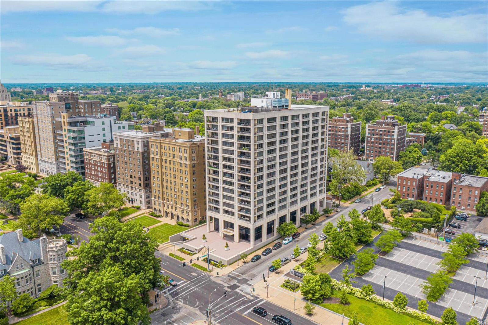 Here is your chance to live in a stylish and iconic CWE midcentury gem. Lindell Terrace is a full-service building only steps from Forest Park, movie theater, coffee shops, restaurants, Whole Foods, shopping & more. The north and east facing 2 bedroom, 2 bath corner unit boasts floor to ceiling windows with views of the Basilica and downtown skyline. The living & dining room combination features two exposures, electric shades, built-in bookshelves, and access to the private terrace. The kitchen offers granite counters, and newer GE and Bosch appliances. The main suite is bright and spacious with three closets, electric curtains, and an updated bath with a shower. Additional guest bedroom or study with plantation shutters. Updated 2nd bath with Jacuzzi tub. Enjoy the gym, conference room, and roof-top patio with 360-degree views. Condo fee includes two unassigned parking spots, heating, cooling, water & basic cable – just pay for personal electricity. Location: City, Corner Location