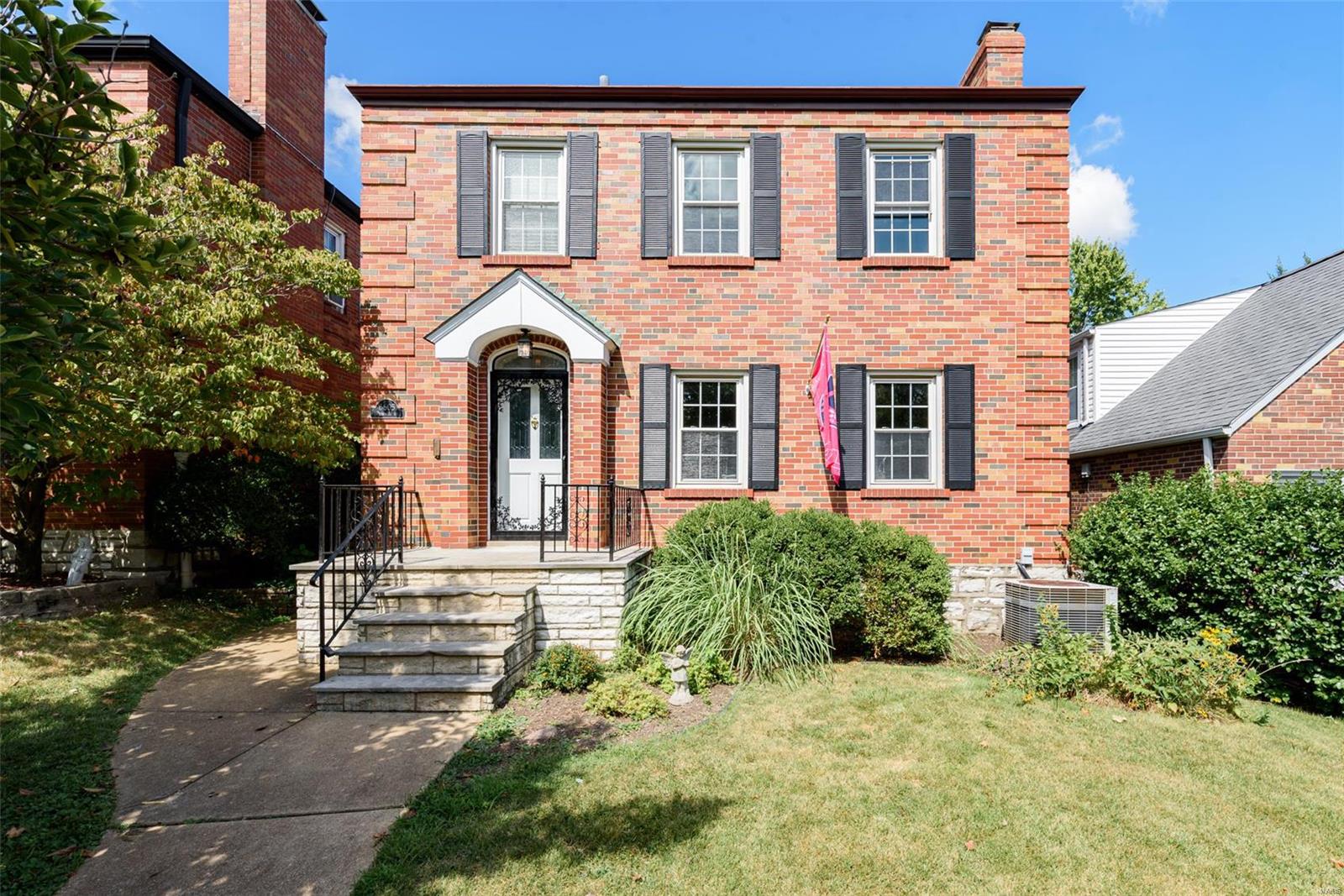 Don't miss your chance for a one of a kind charming, two-story brick home nestled on a quiet street only steps away from the park! The curb appeal is off the charts! A beautiful leaded glass front door welcomes guests, as you walk in you are greeted with custom clay tile, freshly refinished hardwood floors and tons of natural light. The spacious living room features custom built in bookcases and a grand wood burning fire place. The dining room is perfect for large gatherings and has a sliding door that leads to a covered patio. The eat-in kitchen is spacious & features a pantry, stainless steal appliances, clay tile floors & a lovely view of the backyard. A half bath completes the main level. Upstairs you will find large bedrooms, newly refinished floors, a large full bath with beautiful tile that has been kept in pristine condition. Custom windows, laundry shoot and custom door locks are only some of the cool features about this house. Outside you have a 2 car garage & 1 car carport.
