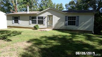 OUTSTANDING OPPORTUNITY!!! Located in popular Hillsboro, this beautiful ranch home is sure to please!! ULTRA-secluded, 2+ acres of privacy are YOURS.  Home features eat-in kitchen, 2-full baths, wood-burning fireplace, great deck, and MORE!  Newer well pump, walk-out basement and HUGE outbuilding for all of your toys makes this one a WINNER!  Schedule a showing today! Property is to be sold in its current as-is condition with no warranties or representations by the Seller. Seller will not make repairs nor provide any inspections. Seller's addendum is required after terms of sale are agreed upon. Special Sale Contract (Form #2043) required. Proof of funds or pre-approval letter required with offer. SpecialListingConditions: Foreclosure