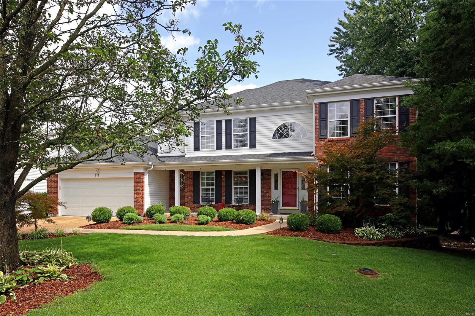 You will fall in love with this 5 bed, 4 bath home with just under 3,000sq ft, not including the finished walk out basement with full bath. This home has everything you are looking for, including a hearth room with 1 of 2 fireplaces, custom cubbies off the main floor laundry, and built in bookshelves in the family room.  You will notice the hardwoods carry throughout the first floor.  The 2 story foyer includes a T-staircase and stately French doors that lead to the main level office.  The vaulted master suite boasts a large walk in custom closet. Rounding out this Ballwin gem is a deck with plenty of room to entertain which overlooks the spacious fenced in yard. Sprinkler system, closet organizers, walk-in pantry, granite counters, Roof 2015, garage door 2012, new hot water heater, sump pump 2019, dishwasher, oven, micro 2019, stairs/upstairs carpet 2014, deck/playset stained 2019, playset 2011, floors 2008, upstairs HVAC 2009, 2 fridges and playset to stay with house.