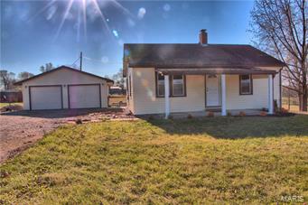 2 bedroom, 1 bath ranch home on full basement.  32X24 insulated, 2 car detached garage.  Located just outside Old Monroe and close to Hwy 79.