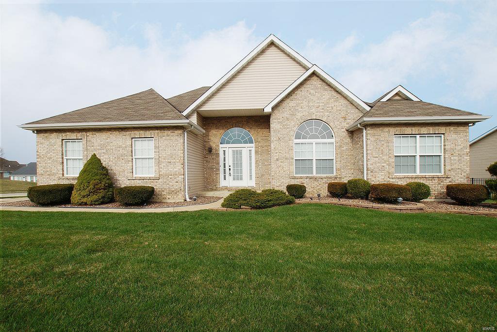 Beautiful ranch home w/over 2,000 sq ft living space and is in MOVE IN condition.  This home has so much to offer!  Vaulted ceilings in the living room along with gas fireplace and Beautiful hardwood flooring, Separate dining room,  crown molding in bedrooms and baths, main floor laundry, newer 3.5 ton furnace/ac (8/17), updated hall bath, Kitchen w/ 42" cabinets, pantry, center island, ceramic tile and faux stone wall above sink.  Master bedroom features coffered ceilings, walk in closet and master bath with sep tub/shower and double vanity sink. 2 addl bedrooms with carpet and one has 12 ft ceilings. Huge unfinished LL has a rough in and is a wide open space just waiting to be finished. The 2 car side entry garage has been drywalled and painted and has a newer garage door.  Aggregate covered patio off the kitchen is a perfect space to unwind.  The yard is level and has a sprinkler system.  Come see this one - you will not be disappointed. Easy highway access, shopping and restaurants
