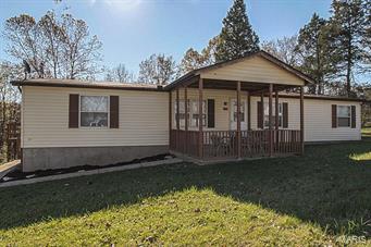 A Must See!! Spacious 3 bedroom, 2 bath home with over-sized, detached 2-car garage on over 2 acres! Enjoy peace and quiet on your covered front porch or invite family & friends over for a bonfire in your private back yard. This home has been remodeled with new flooring, paint, and window blinds. Both full bathrooms have new vanities, mirrors, and lighting. The large eat-in kitchen has plenty of cabinet and counter top space. Relax and watch a movie in your living room or sit and talk with a hot cocoa by the wood-burning fireplace surrounded by built-in bookshelves in the family room. With the separate dining, main floor laundry, and large master suite with a walk-in closet, this home has all you need. Not to mention all of the extra space in the detached garage! Refrigerator, washer, dryer, and 1-year Home Warranty included with sale. This home is just what you are looking for and more, so call before it is too late!!