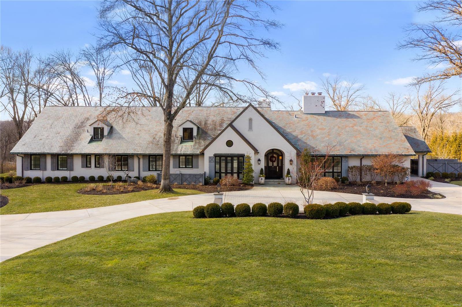 Modern Sophisticated Living in the heart of Ladue. Tucked away on 6 private acres this estate offers Casual Open Living plus all the outdoor amenities you desire. Entry boasts high ceilings & welcoming atmosphere w/ a natural flow into the perfectly crafted living rm & dining rm. Handsome office off entry w/unique barrel ceiling & built-in bkcases. Rich hardwood flrs thru-out! Spacious Great Rm w/ beautiful views of the outdoor living spaces offers 2 french doors.  Large high-end kitchen w/ a touch of elegance. This home is ideal for entertaining & comfortable living! 4 Main floor Ensuite Bedrooms. Private Owner's Suite w/ spectacular view of private acreage plus luxury bathrm & 2 Large walk-in closets. Upstairs features 2 bedrms & Huge family room w/unlimited possibilities. LL includes entertaining space w/ wet bar, wine cellar & 2 exercise spaces & full bath. Breathtaking covered patio w/ stone fireplace wall & built-in grill, pool and spa all overlooking the exceptional grounds. Additional Rooms: Mud Room, Wine Cellar