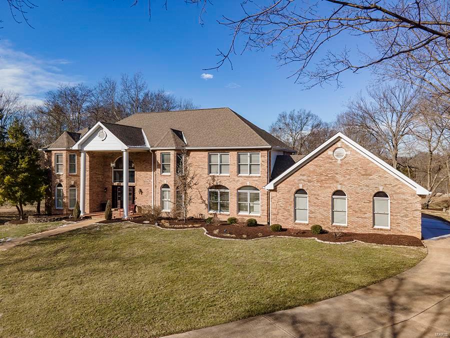 Welcome to this gorgeous, Custom Build.  Notice the stately home as you pull into the landscaped circle drive. Enter through the newer custom doors and get blown away by the 2 story entry, marble foyer & elegant new chandelier. Imagine family gatherings or exquisite dinner parties being prepared in the stunning, updated kitchen with high end cabinets, granite counters,& Viking/Bosch appliances. The center island is HUGE with plenty of storage even while seating 5+. Kitchen boasts a walk-in pantry large enough for a 2 cart Costco run! You will also be impressed by the main floor primary suite, & custom closet. Second floor has six bedrooms, all with walk-in closets and shelving units. There are also three Jack & Jill bathrooms on the second floor. The finished, walk-out lower level has a bar area, second office with two sets of French doors, gas fireplace, exercise room, full bathroom, huge storage area, & amazing theater room with two-tiered seating, and six leather reclining loungers. Additional Rooms: Mud Room
