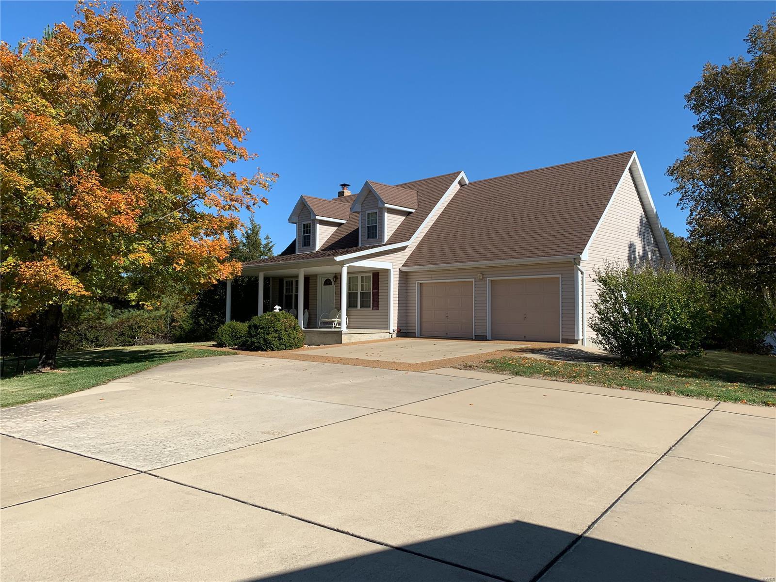 Just south of Lonedell, Missouri off HWY FF, you will find this charming home with just over 1,100 square feet of living space. The main level features a dining room, living room, sitting room, full bathroom, kitchen, and laundry room. The upper level has two bedrooms with window nooks and a full bathroom to share. The lower level is a 650 square foot, unfinished, walkout basement with ample storage. There is also a two-car garage just off the kitchen. Off the back of the home, you find a deck, perfect for enjoying the morning cup of coffee while watching the turkeys strut. Need a workshop? This property has you covered. There is a 35 X 25 workshop with electricity and concrete floors. Perfect for extra storage or working on your weekend hobbies. The ground is a nice mixture of timber and open fields featuring a 1.25 acre stocked pond that offers hours of relaxation for the adults and long-lasting memories for the kids.
