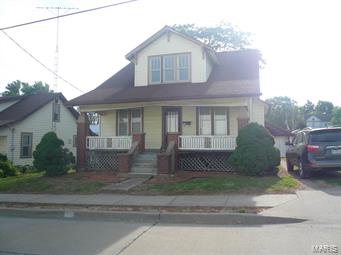 This 1 1/2 story house is split into a 2 family apartment. The main level has 2 bedrooms, kitchen, dining room, living room, & bath. Upstairs has a separate entrance & utilities with 3 rooms, bath, & laundry area. Great investment opportunity!