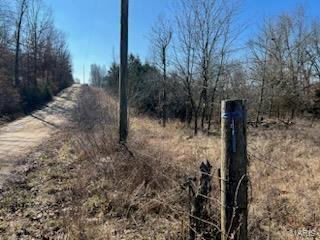 3ac m/l with water and electric. The property has an old home that needs to be torn down, home has no value. This property has a spring and is the perfect spot for your new home.