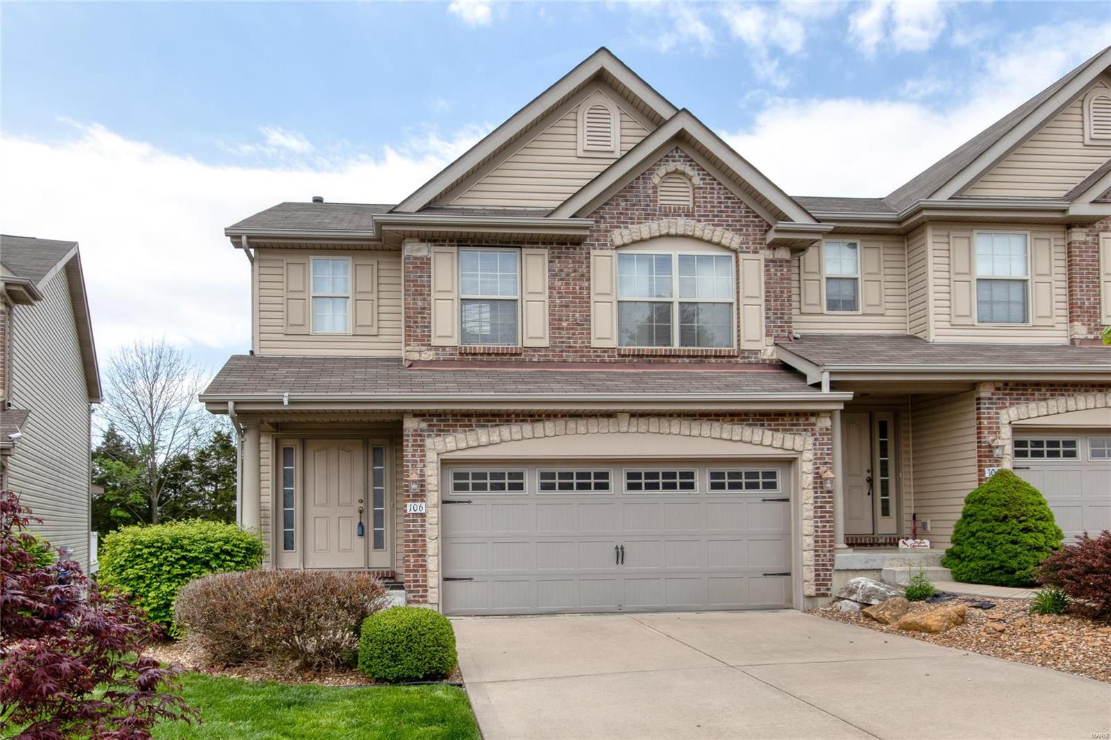 Welcome home to this lovely 3 bedroom / 2.5 bath townhome located in the Townhomes At Prominence! Enter into the foyer and enjoy the wood textured laminate throughout the main level. Walk through to the living room featuring a wood burning fireplace with recessed lighting over the mantle and lots of natural light! The kitchen features stainless steel appliances, beautiful cabinetry, and plenty of counter space! The attached breakfast room also has a walkout to the wood deck, perfect for those summer barbeques! Head to the upper level which is carpeted throughout. The master suite features a walk-in closet, ceiling fan, and full bath! The master bath has a double sink vanity, full shower stall, and a soaking tub for relaxing after a hard day at work! Two more bedrooms and another full bath, plus a bonus room complete the upper level! Located within minutes of Highway 40/64 and Highway 70, this home provides access to countless shops and restaurants! Schedule a private showing today! Location: End Unit, Suburban