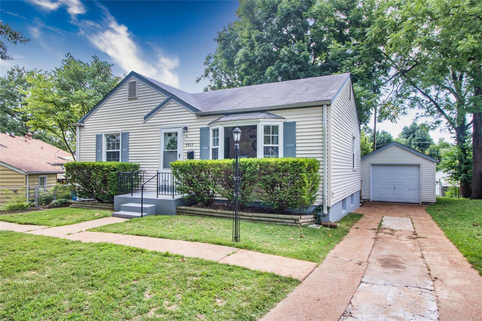 Check out this cutie! Very centrally located! Would be a great starter home with hard wood floors throughout. Spacious living room with bay window, 4 seasons room that look out to a private, fenced backyard. Two bedrooms on the main level and plenty of space in the lower leve to get creative for additional living space! Kitchen has stainless steel appliances and newer tilt-in windows. Two driveways (one on each side of the house) and detached garage with opener. Easy access to most of the highways and just minutes from Clayton!