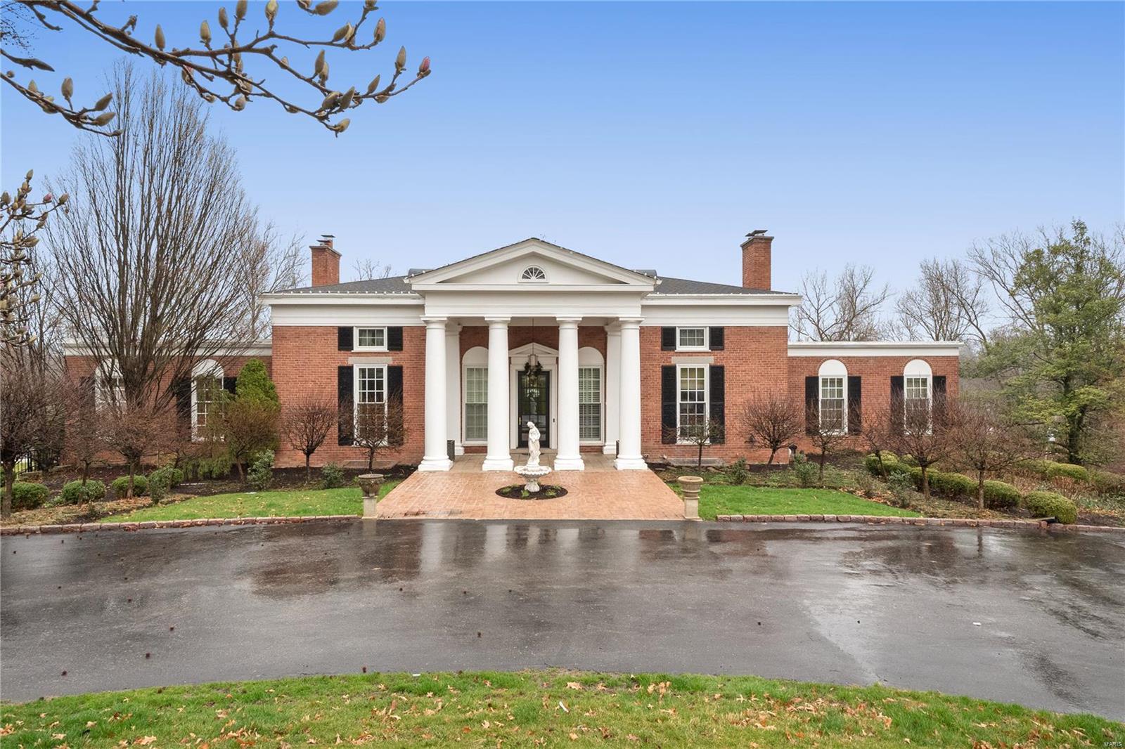 Old Hollywood beacons when entering the beautiful and tranquil home of 49 Trent Drive. You can almost hear Dean Martin tunes playing and the finest accoutrements prepared for the evening planned. The soaring 12' ceilings and intricate moldings are of craftsmen long ago. The impressive floor to ceiling windows welcome the natural light throughout this manse. Formal spaces and the outdoor covered terrace are conducive to having the best gatherings yet warm intimate floor plan makes this home a real show stopper. Well appointed kitchen with high-end appliances will delight the chef of the home. Family room offers built-ins and a deck overlooking the wooded lot. Primary ensuite and private den are other amazing features of the main floor. Second floor offers flex space, two bedrooms and a full bath. Party destination is the lower level! Elevator, theatre and wine room, sauna, changing rooms, bath for easy access to the saltwater pool and outdoor patios. All this lux in a gated community. Additional Rooms: Wine Cellar
