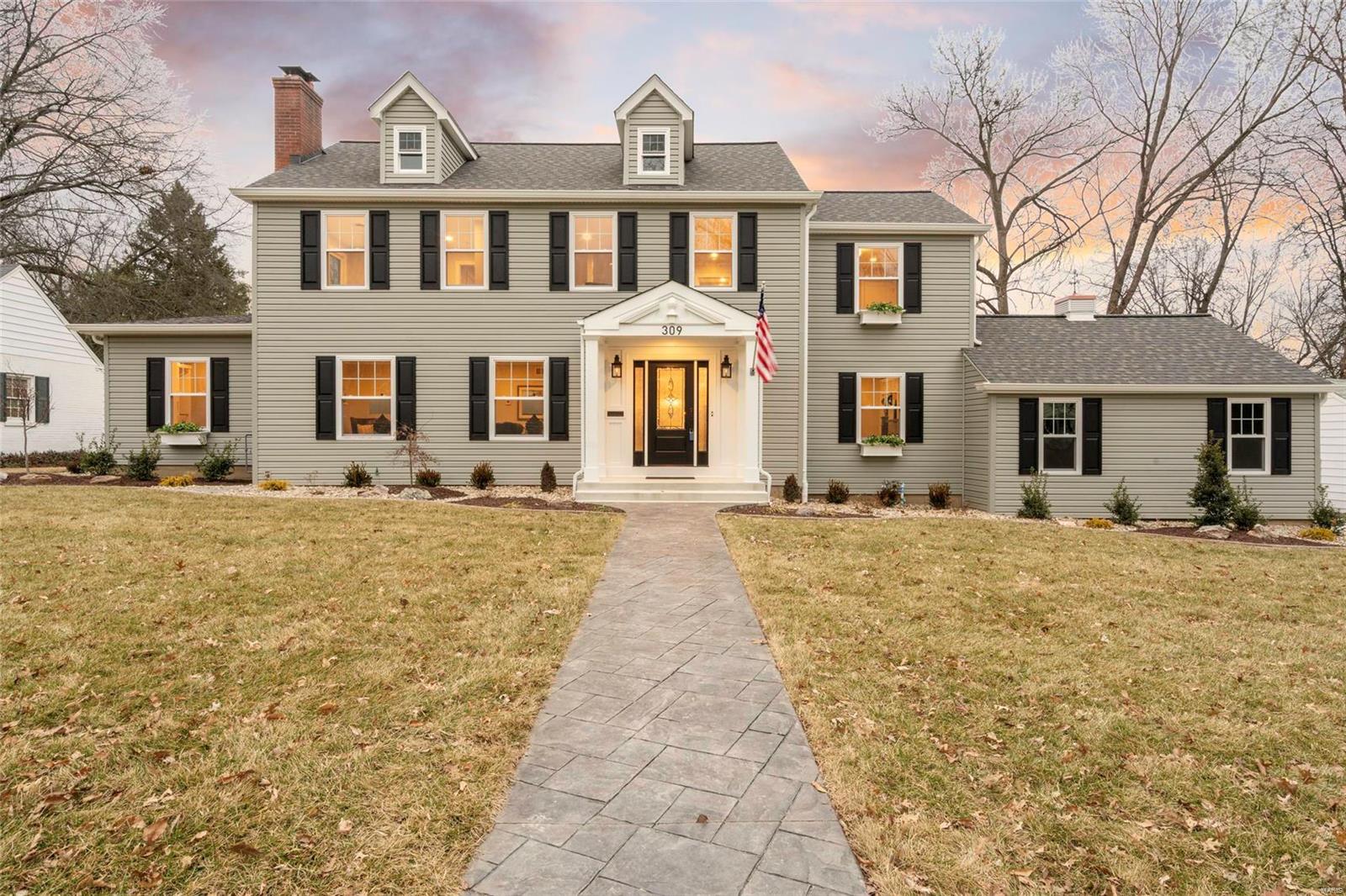 Comfortably blending modern conveniences with local traditional charm. You will love this gorgeous 1.5 story home just blocks from downtown Webster Groves. Situated in a friendly community with great neighbors and schools, what more could you want?  This home was substantially renovated and expanded in 2018 for the person wanting to move right in today. This home features a modern traditional exterior matched with an inspiring transitional interior.  3/4" thick 4" plank hardwood floors primarily throughout the 1st and 2nd floor. Kitchen: Custom cabinetry, Dual islands, Cambria quartz tops, open shelving on island. Master bedroom with tray celling and grass cloth accent wall. Freestanding Jacuzzi soaking tub w/Brizo polished nickel tub filler. 2 fireplaces. Circulater ceiling detail. Custom 6" base trim & 5" crown throughout. Open loft parlor w/exaggerated plaid design. Lower level has custom wainscoting and luxury vinyl floor with additional space to build out. Fence. Sprinkler. Additional Rooms: Mud Room