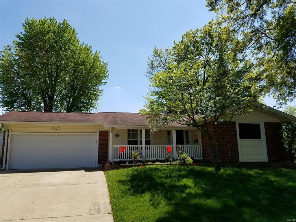 This charming 3 bedroom, 2 bath home offers a beautiful level yard with professional landscaping, 2 car garage and covered porch. As you enter this home you will notice the spacious open floor plan & beautiful hardwood floors. The updated custom built kitchen features built in appliances as well as an abundance of cabinet and counter space, ceramic tile flooring & back splash, crown molding as well as convenient access to the back patio with beautiful view of the fenced in private back yard. The finished lower level provides for additional living space! This home is move in ready & sure to please!