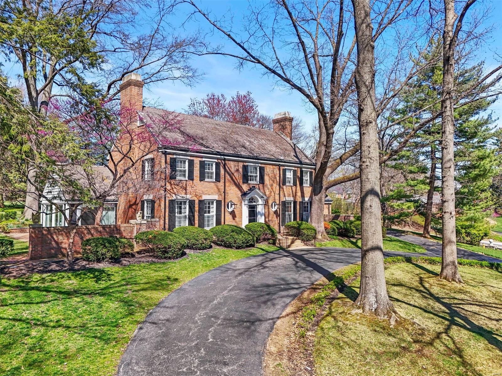 Much like her owner of the past 40 years, 3 Greenbriar Drive epitomizes beauty and grace. From the moment you enter the foyer with a curved staircase, the love and attention to detail is apparent. The well appointed living and dining rooms are perfect for entertaining while the sunporch and study are inviting and cozy. Offering traditional charm with modern convenience, the  kitchen leads to the private patio. Also on the main level is a guest suite. Upstairs, the primary suite boasts a stylishly laid out bath and includes a closet that could be converted back into a bedroom. Two additional bedrooms and full bath complete the upper level. From the top (a walk-up, full ceiling height attic) to the bottom (a finished basement with a fireplace and full bath), this home offers all the space you need.