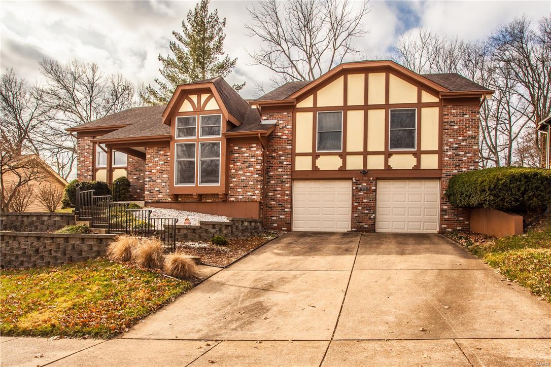 Are you looking for  home with modern updates? Neutral decor?  Large fenced backyard?  And an award winning school district?  Look no further.  Fantastic 4 bedroom , 3 bath house with great space and vaulted ceilings.  Walk in to the open entrance foyer and sunken living room with over-sized window.  The large main floor family room conveniently opens to the breakfast area and kitchen.  The master bedroom suite has a large walk-in closet, updated master bath with double vanities. Main floor has 2 additional bedrooms and an updated hall bath.  Lower level has laundry, an additional bedroom with newer cork floors and an updated full bath.  Great potential to finish the lower level and add your personal touch!  The newer cedar deck and fenced backyard that backs to trees has plenty of space for entertaining.