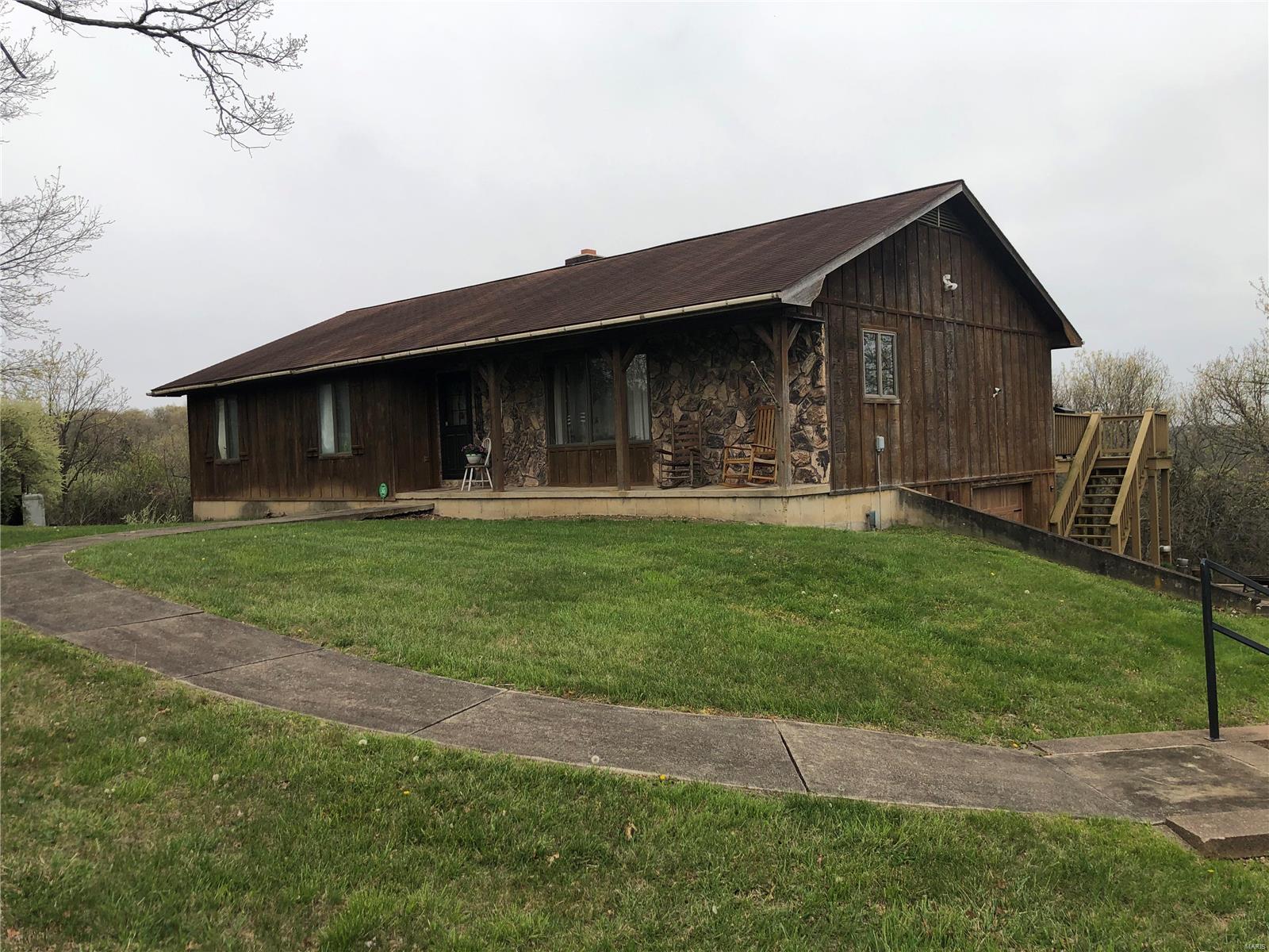 Great property north of Cuba.  Ranch home with full basement with about 900 sq ft finished.  Bedroom in the lower level with no window, office and family room.  Master bedroom  has a large  closet room. Kitchen has a breakfast area also has living/dining room. Shop/garage is 60x40 with 20'( concrete floor) enclosed lean too ( gravel floor)2 chicken coops/storage and a 10x12 shed. There is a outdoor wood  boiler/furnace that not been used in teh last few years. Lot see the attached  view.