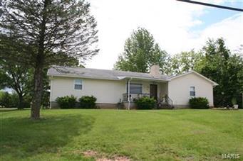 $64,900 is NOT a Typo! It's true, it's real. It's has fresh paint and new carpet. It's available to move in right now. Complete with stove and fridge, big bedrooms, big baths, fireplace, large window for lots of light, lots of nooks for storage like most of the homes built in the 70's have, wide hall, large formal dinning, covered front porch, handicap ramp in the back. Garage has a built in bar area with lots of storage. Call to view today, tomorrow may be to late at this price!