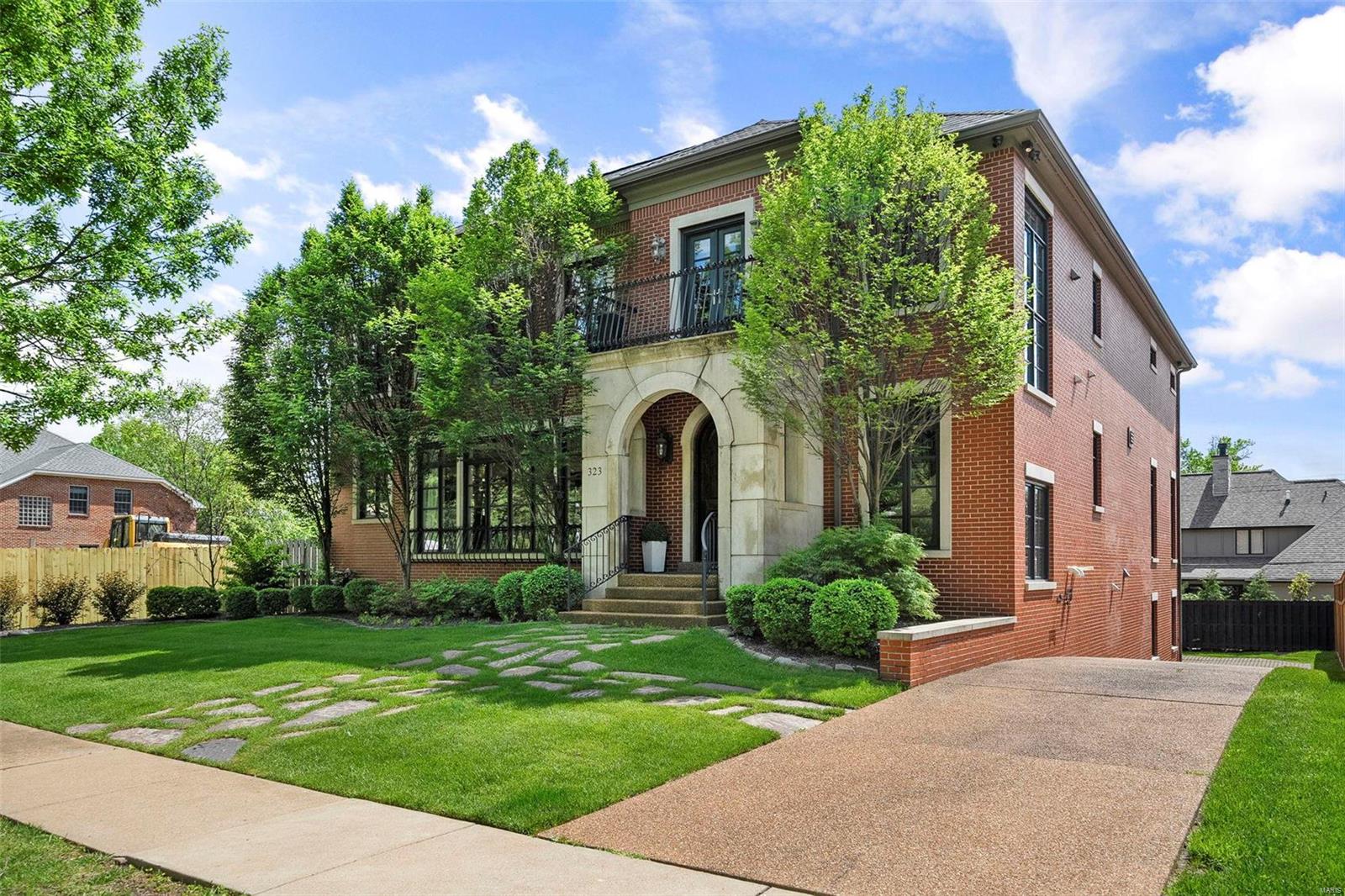 This Neoclassic inspired home is located in sought-after Clayton Gardens. This stately residence features all the modern amenities necessary for civilized living complete w/ elevator servicing all floors + a 4 CAR GARAGE. Gracious entry foyer w/ Travertine floor, light-filled living room w/ custom bar, wine chiller, ice maker & 2 Sub-Zero fridge drawers. French doors open to private veranda overlooking the back yard w/ waterfall, & outdoor frplc, ideal for al fresco dining Epicurean kitchen w/ Sub-Zero & Bosch appliances, Wolf 6-burner gas range w/ dbl ovens, granite counter tops, custom cabinets, large island w/ prep sink opens to family rm w/ beamed ceiling, bookcases, frplc, casual dining area + counter seating 1st floor features a bdrm w/ full bath. Large primary suite w/ gas frplc, vaulted ceiling & custom fitted 19' x 13' walk-in closet. Spa-like primary bath w/ air-jet tub, dbl. vanities & walk-in shower. Finished LL complete w/ built-ins, full bath & 600 +/- bottle wine cellar. Additional Rooms: Wine Cellar