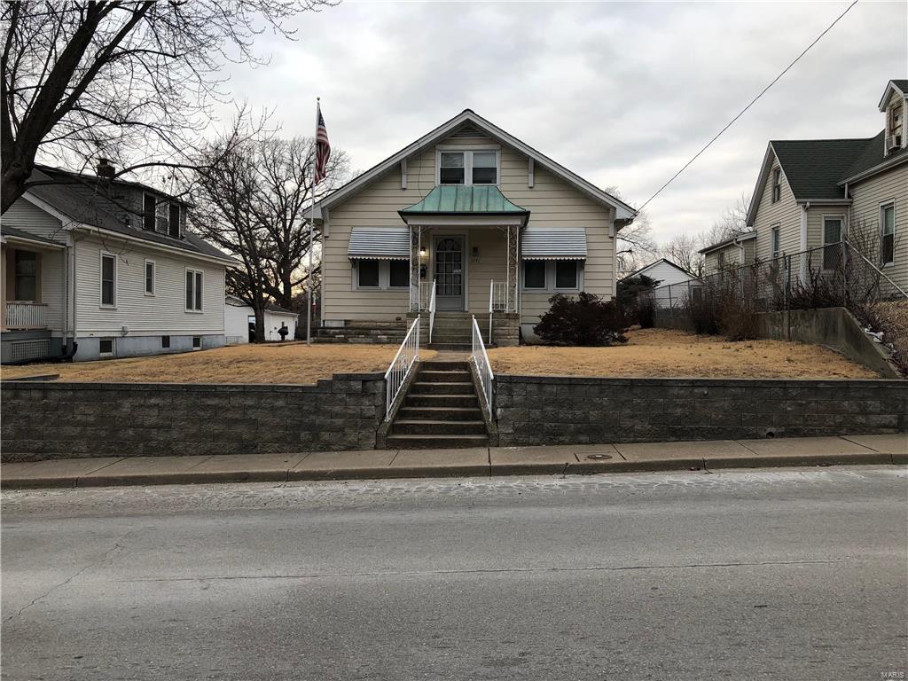 Cute 2 bedroom (possible 3rd on top level) bungalow in the City of St. Charles.  Recent upgrades include: HVAC in 2016, hot water heater in 2014, newer vinyl windows, 200 amp panel and updated kitchen.  There are wood floors in bedrooms and it appears from the floor vent opening that there are wood floors in the dinning and living areas.  There is a one car detached garage and covered parking for two vehicles in the back of the house (alley access).