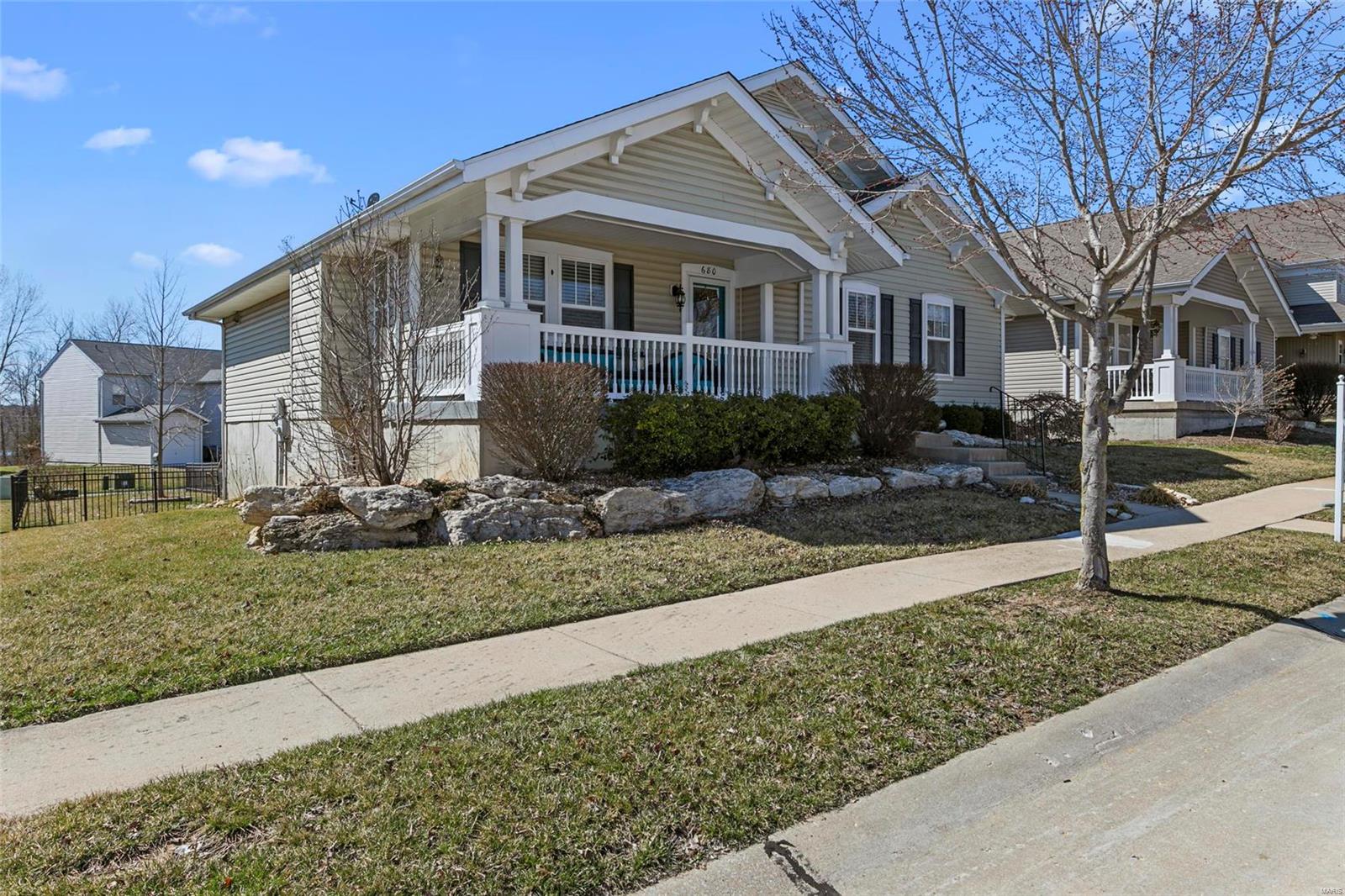 WingHaven STUNNER! 4 bd, 3 bth WO ranch has the "WOW" factor! Dark, cafe bamboo wood runs throughout the main level. GR features gas FP. Kitchen offers Cambria quartz, custom tile backsplash, stacked stone center island/breakfast bar, designer pendant lights, ss appliances, & french door access to the lovely oversized deck. The master suite features a walk in closet, tray ceiling, bath complete with a soaking tub, custom tiled shower & more gorgeous quartz. LL w/ 4th bed, full bath, family room, & rec room w/full kitchen & walk out access to patio complete w/hot tub! New roof, Professionally landscaped yard, custom closet systems in all main level bedrooms, sprinkler system, security system, oversized 3 car garage w/epoxy coated floor & utility sink. Situated across the street from one of the Boardwalk's 3 tot lots & walking distance to Petrichor Brewing, the Boardwalk's newest restaurant, St. Charles County Library & the outdoor pavilion where all the summer fun in Winghaven happens!