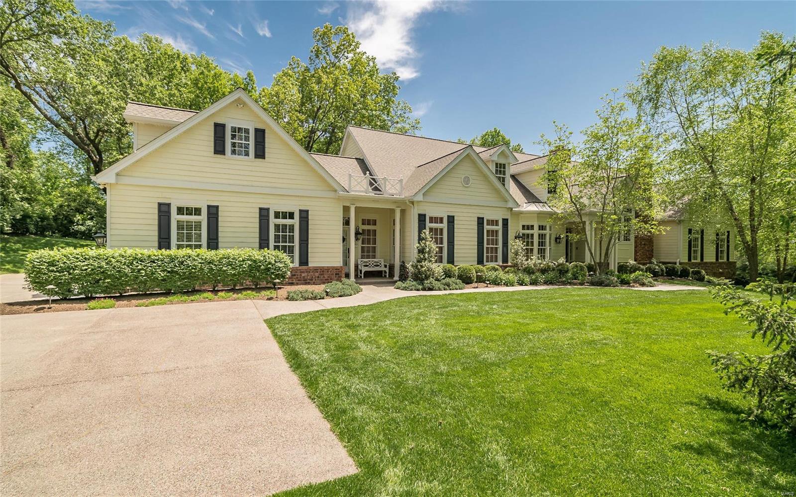Charming 1.5 story situated on a beautifully landscaped 2+acre lot with attention to detail throughout, this 4 bedroom, 5.5 bath home features open spaces, 10'ceilings and over 6250 sq ft. ideal for entertaining. The 2 sty entry leads to the formal dining room and great room with fireplace that adjoins the stylish kitchen with center island and breakfast room that opens to one of the many terraces.  The spacious main floor master suite includes a study, luxury bath and walk in closets with premier views of the property and doors to the screened porch. Also on the main is an in-law suite with sitting room, full bath and private entry.  Upstairs are two very generous bedroom en suites and a bonus room. Lovely finished walk out lower level with an additional 2000 sq. ft. has a full bath, bar area with refrigerator, dishwasher and sink with French doors that walk out to the pool area. 3 car garage, main floor laundry, 9'ceiling on 2nd, irrigation system, incredible storage and more!!