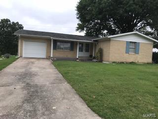 Full brick home on double-lot! First time on the market. Home has mostly hardwood floors throughout. Separate dining room, living room, and kitchen. Eat-in kitchen has ceiling height wood cabinets. Three bedrooms each with a large closet. Master bedroom has half bathroom. One full bathroom on main level. Basement is partially finished with family room and bar area. Unfinished part of basement has workshop area, storage room, and laundry room. One car attached garage. Golf course like grass is an added bonus! Located in Mark Twain School District.