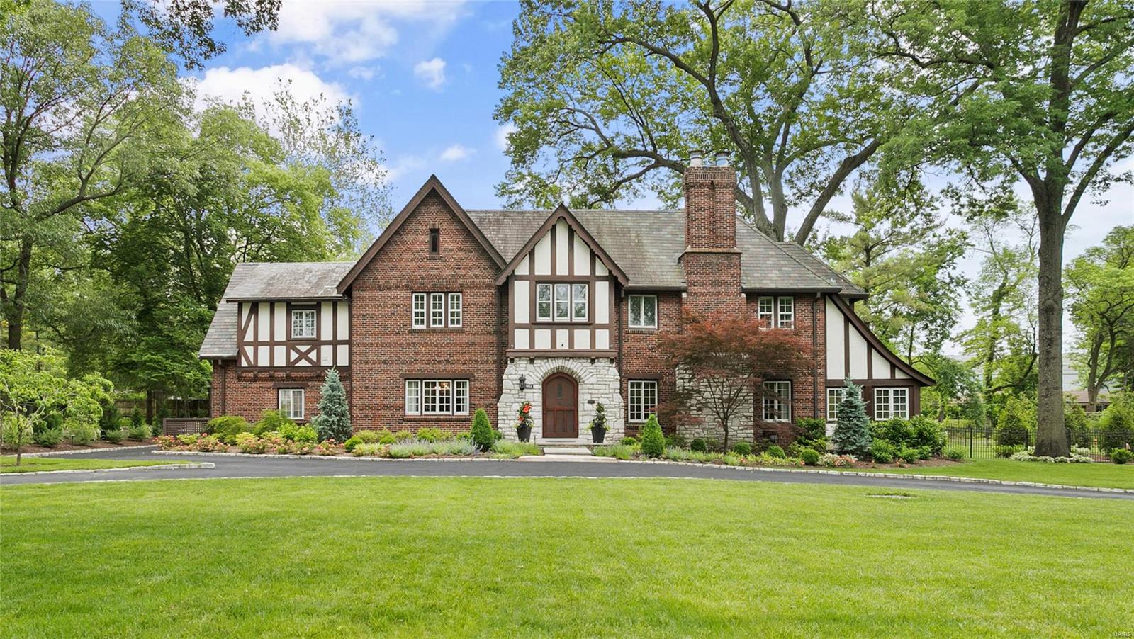 Welcome to this beautiful English Tudor House located in the prestigious, historical neighborhood Hampton Park. The moment you enter you will be embraced by castle like walls and beautiful Terrazzo flooring, formal living room with marble fireplace, gracious dining room, family room with a wet bar built-in , huge, open kitchen/breakfast with center island and custom cabinets with granite counters, 3 car garage spaces , exquisite landscaping featuring a nearly new pool and a large patio/outdoor entertainment space with wood burning fireplace and Tv. Property also includes a guesthouse / pool house with bedroom and full bath that overlooks the pool. Additional Rooms: Sun Room