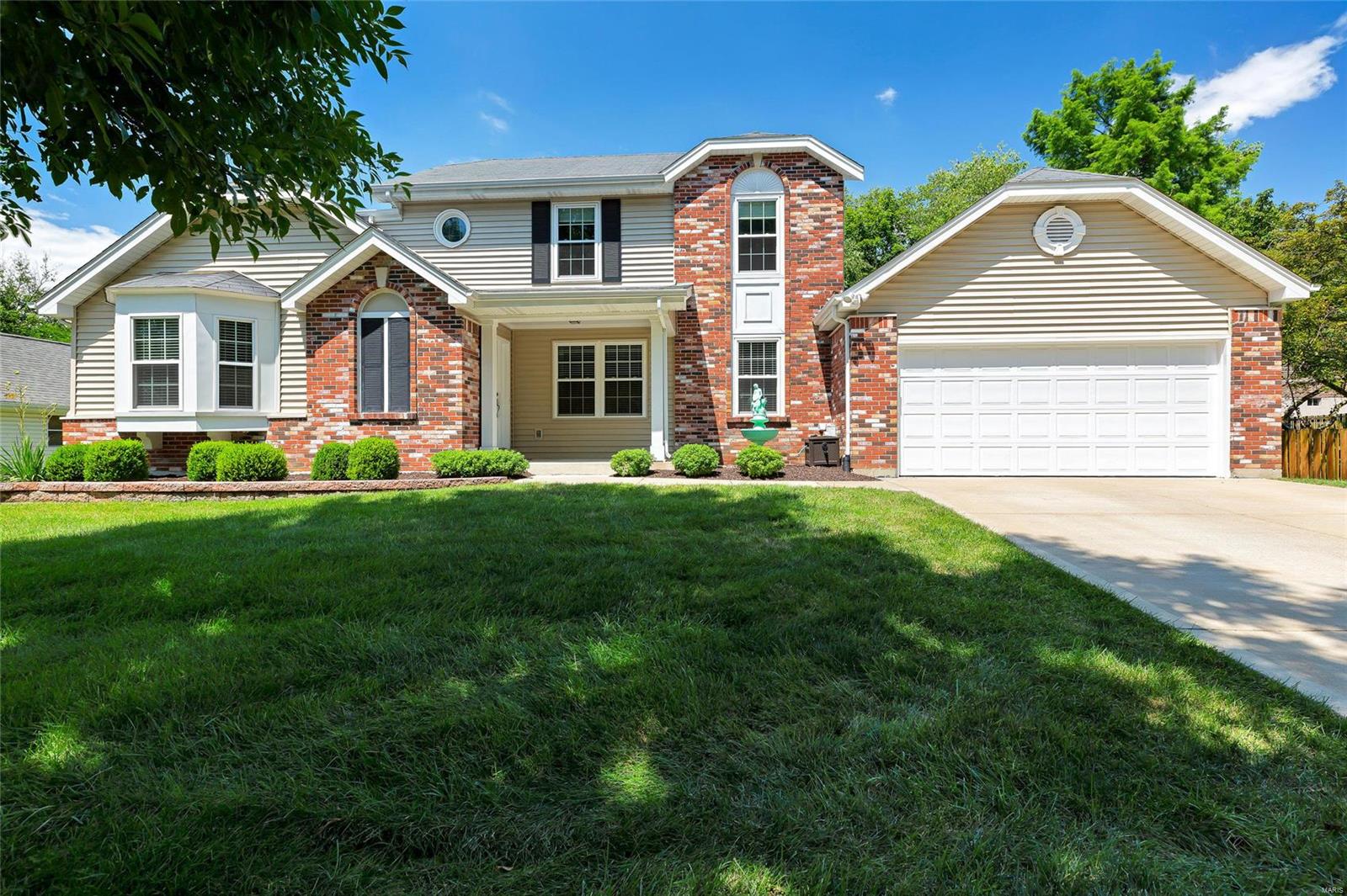 1.5 story with over 2900 finished sq ft; Hardwood flooring flows through the foyer, dining and living rooms in this open floor plan; Architectural interest abounds with vaulted ceilings, plant shelf and a catwalk overlooking the great room; Luxury vinyl tile flows throughout the great room w/ woodburning fireplace, the breakfast room and in the recently updated kitchen which features granite counters, custom cabinets w/crown molding & soft-close drawers, recessed lighting and breakfast bar/pass-thru; Main floor master suite features slider to patio, double comfort-height vanity w/ granite top and large walk-in closet w/ wood cabinets, shelves & shoe organizer! Upper level w/ three bedrooms and full bath w/ over-sized double vanity. Finished lower level offers spacious rec room, dry bar w/ beverage cooler, recessed lighting & built-in ceiling speakers; Spacious patio overlooks neatly landscaped yard backing to trees; Sprinkler system; NEW roof coming in AUGUST