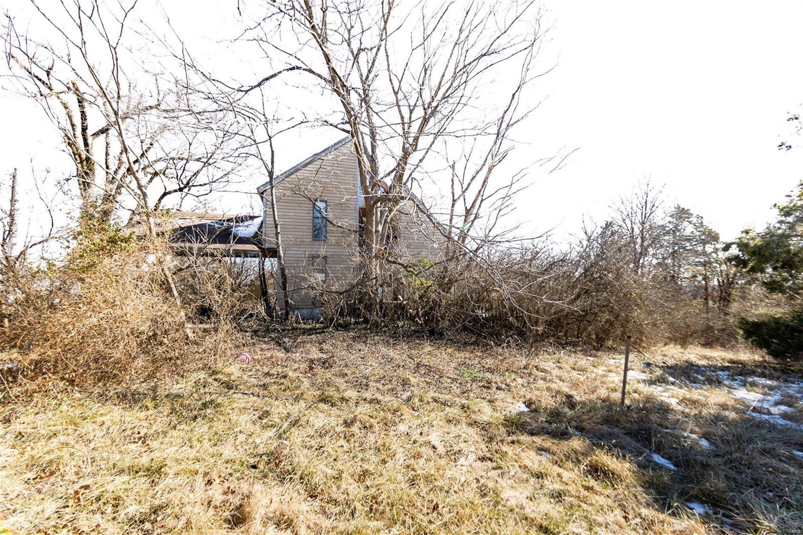 Check out this fixer upper!! Home is need of some repair, would make a great home fixed up, great location. Call today to schedule your showing.