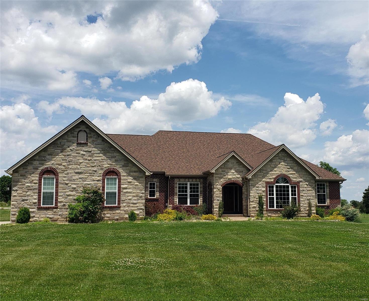 Exquisite, Gated Entry Estate w/Custom Ranch Home w/6146+/- Finished sq ft on 13.23+- ac Setting Featuring Glass Enclosed Porch w/Outdoor Kitchen, Inground Pool, Hot Tub, Outdoor Kitchen, Stocked Lake & 285x60 State of the Art Steel Building w/3600sq ft of Office Space & 3600sq ft Mezzanine Overlooking the 13,500sq ft Warehouse Area w/2 10x18ft Garage Doors. The Home Features Massive Great rm w/floor to Ceiling Gas fp & Vaulted Ceiling, Chefs Kitchen w/Custom Cabinets w/Some Glass Fronts & Wine Rack, Granite Counters, Double Oven & Induction Stove, Cathedral Ceiling Breakfast rm, Separate Dining w/wood Floors, Office w/ Built ins. French Doors Lead you to the Owners Suite w/Coffered Ceiling & Triple Bay Window, Dual in Closets, Custom Walk-in Shower w/Body Sprayers, Jet Tub & Dual Sinks in the Owners Bath, 2nd Bedroom is a Second Owners Suite w/private Full Bath. Lower Level Features Massive Rec Room, Wet Bar/Kitchen Area, Media Room w/Theatre Seating, 2nd Office and Hidden Safe Room. Additional Rooms: Sun Room
