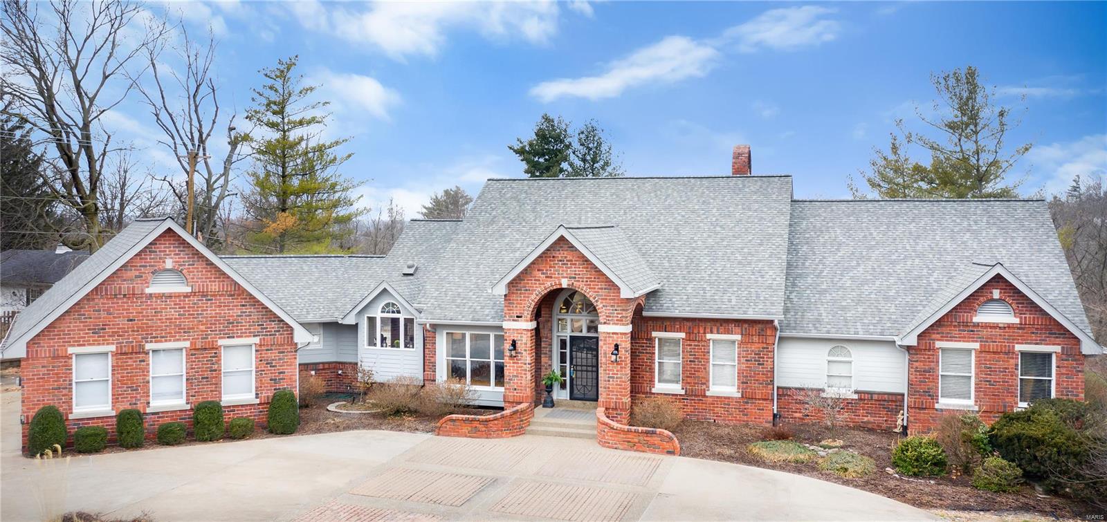 Higginbotham-built ranch home with over 7,000 SF of total living space features dramatic great rm w/ wet bar, soaring fireplace & opens to covered gazebo. Crisp white kitchen is appointed with Thermador appliances & SubZero refrigerator that opens to charming sunroom & breakfast area. Main floor master bedroom retreat features new carpet, fireplace, 2 walk-in closets & dressing area along with access to an indoor hotub & private deck to enjoy morning coffee or take in a sunset. 2 additional bedrooms with private lofts & Jack & Jill bathroom complete the first floor. Lower level features new carpet, 2 beds & 2 full baths one with direct access to pool, wet bar with mini fridge/freezer, ice maker & dishwasher. Wine room & fully equipped exercise room complete the lower level.  Exterior features include private backyard with pool, aggregate patios, new roof & siding, composite decking and 3-car garage. Pool & cool deck resurfaced in 2017. Sit back & relax in this private paradise! Additional Rooms: Sun Room