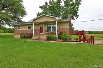 Home full of character and charm that is beautifully updated.  3 or 4 bedrooms, 2.5 baths. Fireplace, Wood Floors and Ship Lap!  Granite counters in Kitchen.  Wet bar and family room.  Work shop in basement and a big outbuilding with garage plus 24 ft Pool with deck to beat the summer heat.  All on 3.8 acres