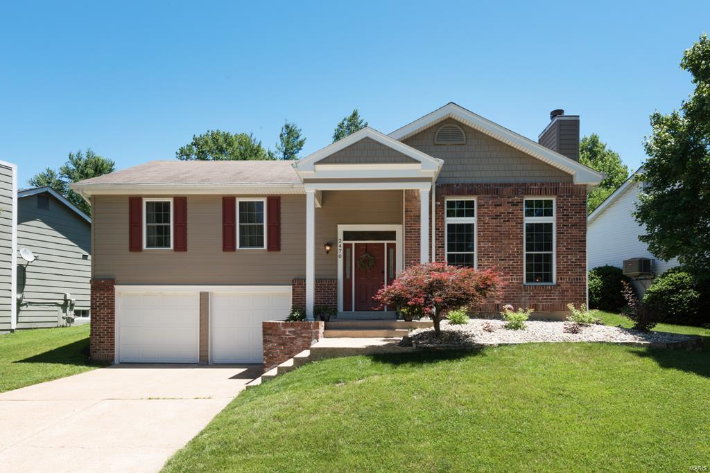 Super Schools, Super Price! Affordable neighborhood home in the respected Rockwood School District. The owner just invested over $16,000 in a beautiful new 12'x26' composite deck with steps and a stone patio (2016), all for your enjoyment. You will love entertaining or gardening in this serene back yard! Inside, step into the living room with a vaulted ceiling, two-story fireplace and front windows, and hardwood floors. Enjoy the master retreat with a vaulted ceiling and its own private door to the deck!  The large master bath has dual sinks and a separate shower and soaker tub. Finished lower level room could be an additional sleeping area or a great family room. Oversized, deep garage has lots of space for a workshop or storage. Updated siding, soffits, fascia, gutters and windows means less maintenance for you! This price point in Rockwood is hard to find.  See it today!