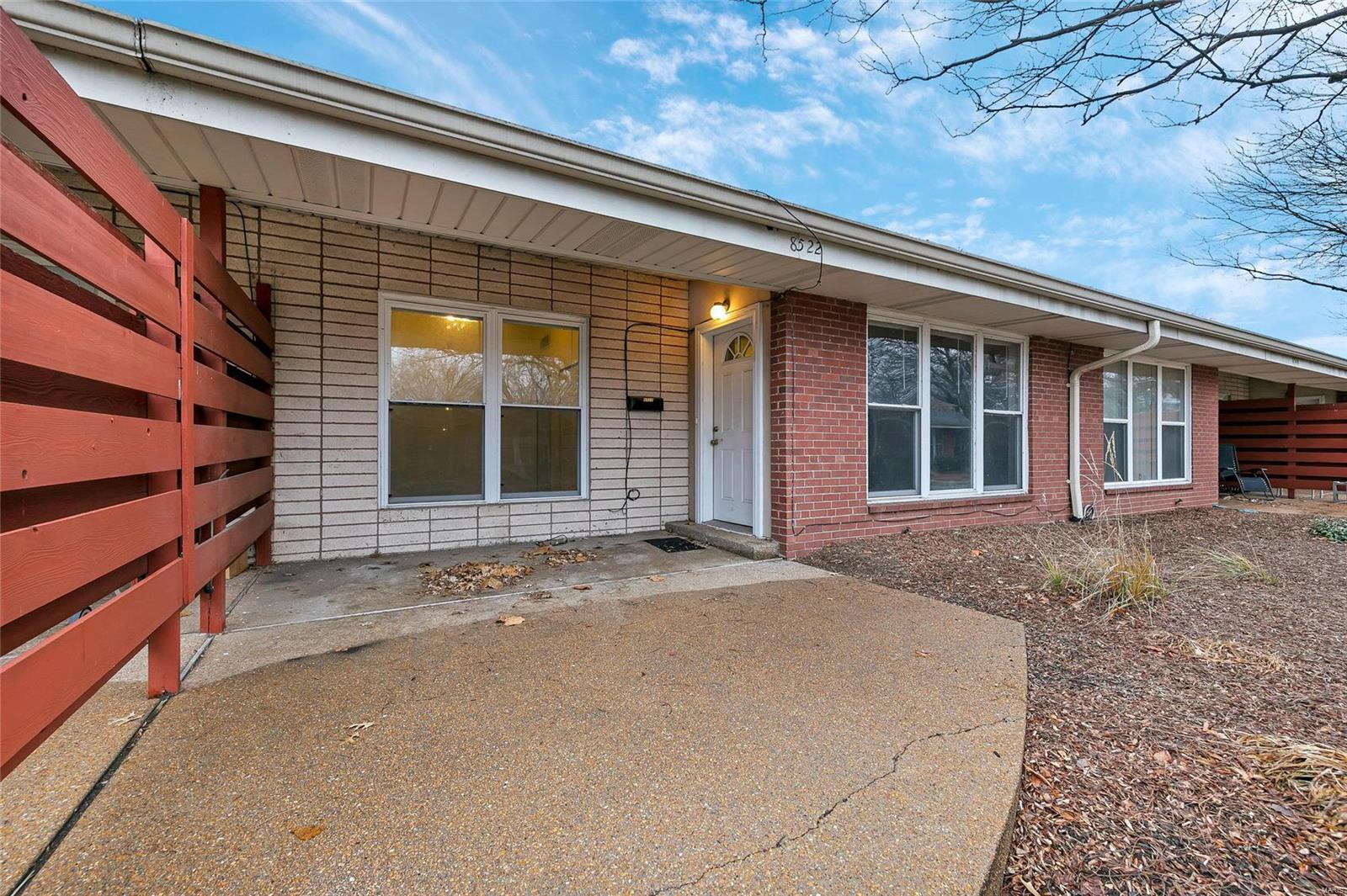 Soaring ceilings and an updated kitchen make this 2 bedroom/1 bath condo an absolute gem! The location is ideal with easy access to Public transportation, major interstates, grocery stores, restaurants, Wash U and the U City Loop.  This condo has a functional layout with bedrooms and bath on one side of the unit, and the kitchen and living areas on the other. The living room offers huge windows, a gas fireplace and contemporary built-in shelving, so its trendy and cozy!  Both bedrooms have ample closet space and vaulted ceilings. The kitchen was recently updated, and is large enough for a table. There is a washer and dryer located conveniently in the unit, and an assigned parking spot directly behind the condo. Location: Ground Level