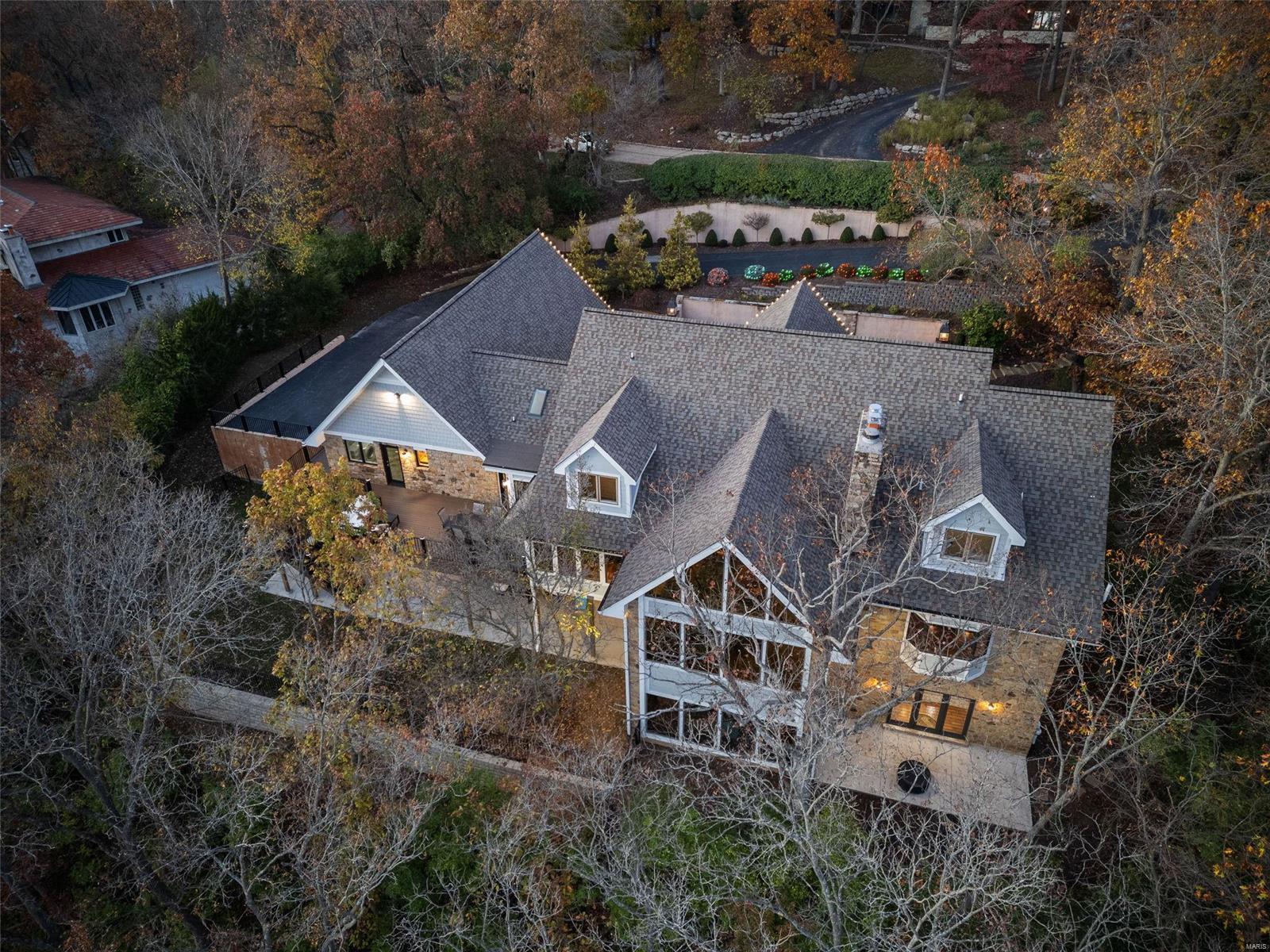 Pool table & LL Barstools included w/ accepted offer. This 1.5 story wooded estate sits on an acre lot & comes w/ 8k+ sqft w/ 5 beds & 7 baths. You will be hard pressed to find a better deal in the area w/ high $ upgrades on big ticket items like newer roof, hardieboard, hvac, deck, landscaping & interior updates. Step into spacious foyer w/ new LVP flooring flowing throughout majority of main lvl & pairs w/ custom wood accents. A Magnificent LR w/ wet bar & serene wooded views is an immense space best for entertaining & big enough to host all of your friends. Primary offers FP, bay window w/ seat & boasts of a well appointed bath w/ spacious closet. 2nd flr comes fully updated w/ 3 bdrms & 2 full-baths/all have pro closet systems. Best for last is fully finished LL complete w/ high end kitchen, bar, 1/2 bath, billiards area & two well-sized seating areas. Adjacent is 5th bdrm w/ full bath & walk-out bonus room which will appeal to those looking for home gym or potential theater room? Additional Rooms: Mud Room