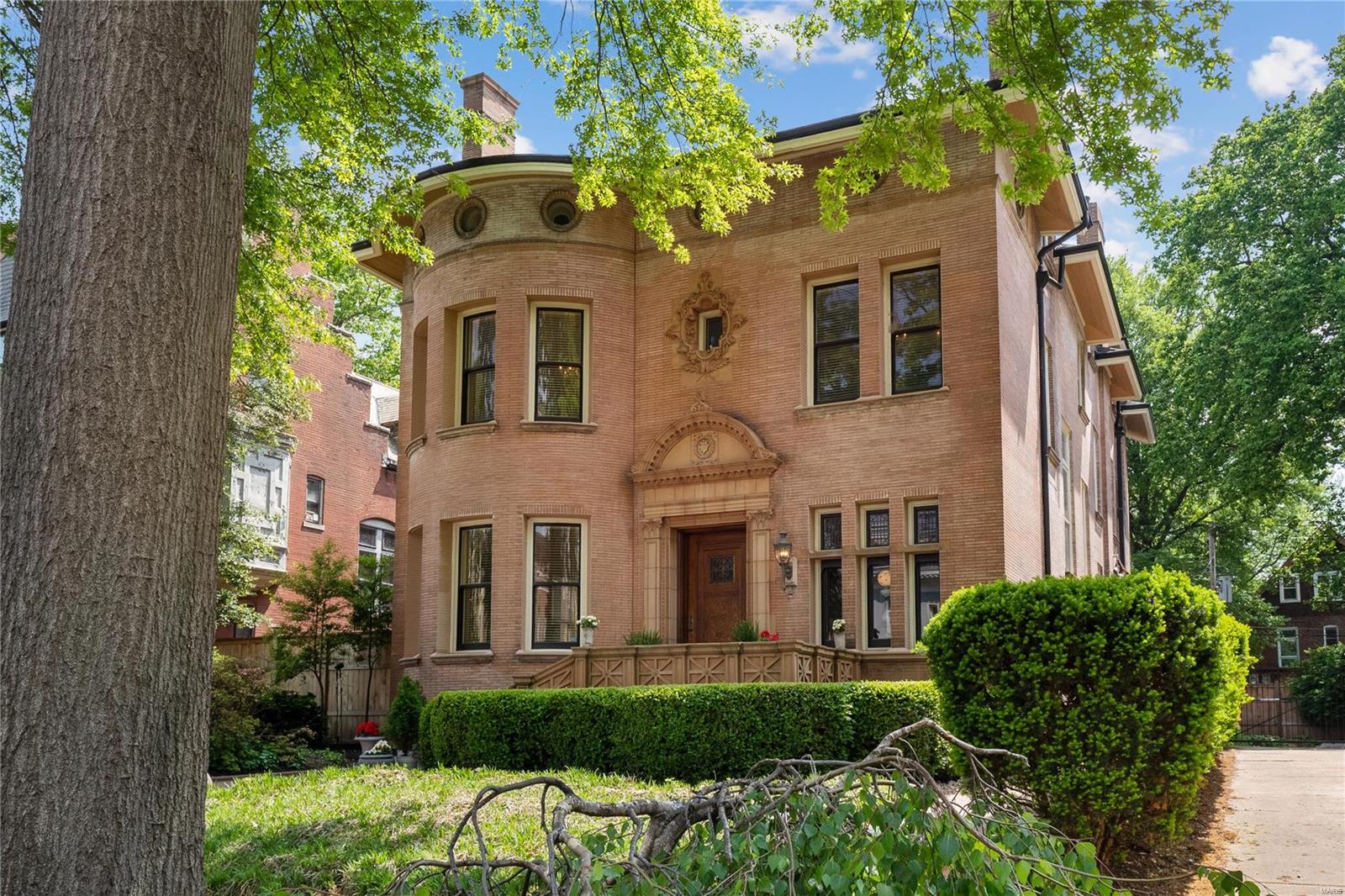 Exceptional 6 bedroom plus Italianate on an exclusive street that is both impressive yet warm, inviting, and suited for modern living. Lovingly renovated showcasing incredible architectural detail throughout. Soaring 11' cove ceilings, historic millwork, vintage and designer lighting, six fireplaces, gleaming hardwood. A series of living spaces leads to a stunning dining room. The recently renovated kitchen, is beyond words with a massive Viking range, marble counters, custom cabinets, coffered ceiling, wet bar. The 2nd floor features a primary  suite including a renovated bath with a massive shower, heated floors, dual vanity. The third level is a perfect family or guest retreat. A recently built deck is the centerpiece of a true urban oasis. Tons of storage, 2 car garage are functional delights. Incredible location. Steps to the heart of the vibrant Central West End and close proximity to BJC, Washington University, SLU, Cortex, Clayton and downtown. This is city living at its best.