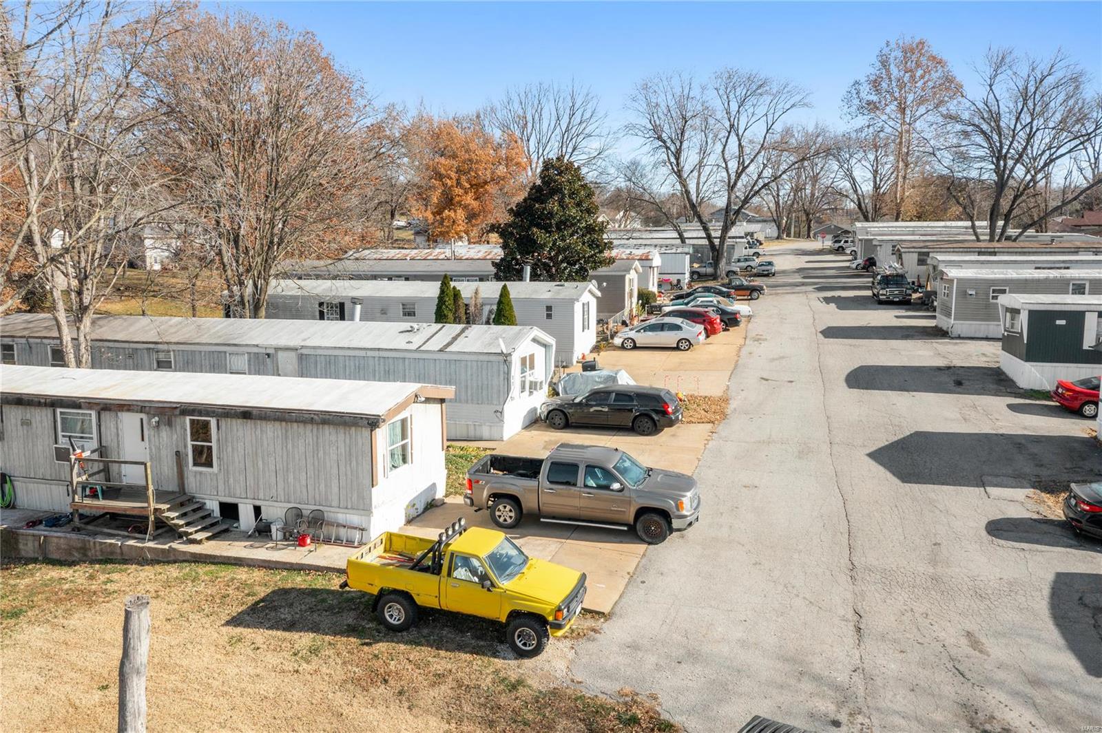 Well-maintained mostly-occupied 22-pad mobile home park on approximately 5 acres in a great suburban location surrounded by single-family homes and lots of green space. Public sewer system was replaced in 2017 and water is also on public! Pads/mobile homes rent quickly and have low operating costs. 5 tenants on HUD leases for guaranteed rent with the remaining being a mix of rent to own reducing maintenance costs for owner and park owned. All tenants are on leases. Also included is a large three-bay garage and a large storage shed. The park is well kept and will cash flow immediately!