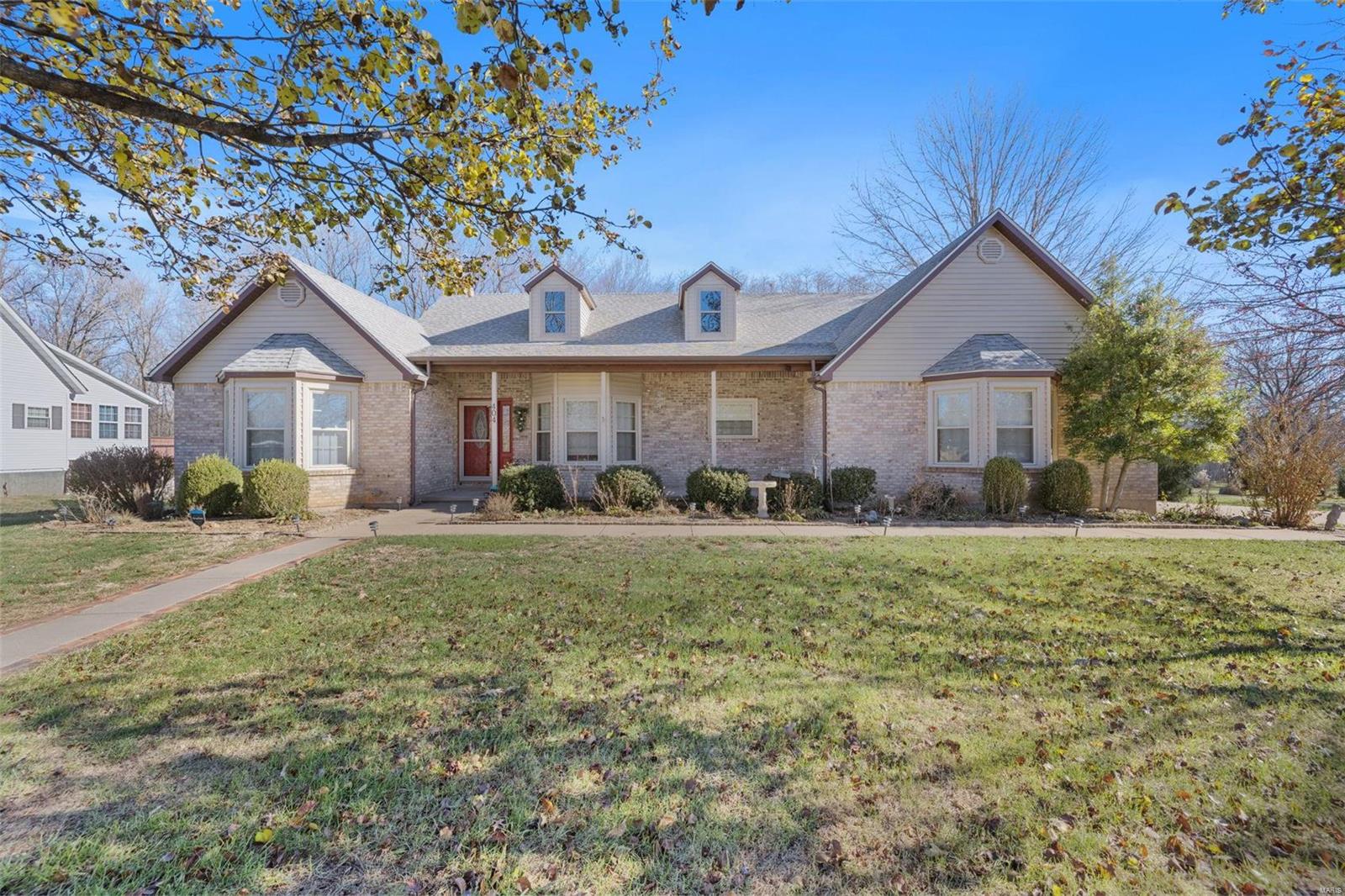 Welcome to this spacious 3 bedroom, 3 bath home in Farmington situated on a large corner lot. The open living area with vaulted ceiling and fireplace walks out to a large deck that overlooks the large yard and green landscape. Beautiful hardwood floors throughout the main living areas of the home including the living room, formal dining room and bedrooms. The master bedroom features a large ensuite bath with a tub and separate shower, 2 large walk-in closets, linen closet and dressing area. The finished walk-out basement features a large family room with a second fireplace, office, sleeping area, bathroom and numerous storage areas. Walk outside to a covered patio space and check out the secluded garden area perfect for a firepit and entertaining.