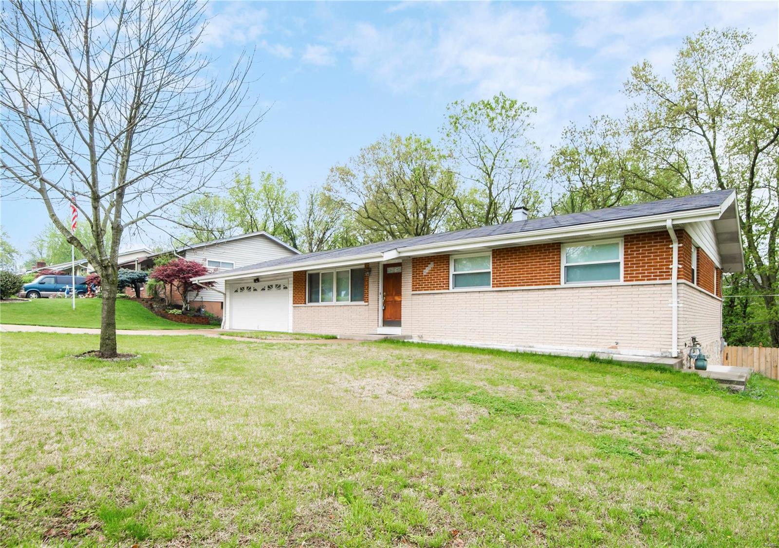 Fabulous Ranch home featuring 3 bedrooms and 3 FULL baths located in the heart of South County. Vaulted ceilings & hardwood floors greet you as you enter the living room. The kitchen features an island with additional seating, recessed lighting & custom backsplash PLUS an eat-in dining area. The master bedroom continues with hardwood floors, crown molding and a full bathroom. Two spare bedrooms on the main floor are clean, bright & also feature hardwood floors. A full guest bath is located on the first floor. Your partially finished lower level provides an oversized family room great for entertaining with walk-out access to the backyard. A potential spare 4th bedroom / office space and FULL bath are also located in the lower level. The backyard offers an NEWER oversized patio, NEWER deck and NEWER privacy fenced yard.  PLUS, a custom oversized garage! A MUST SEE!